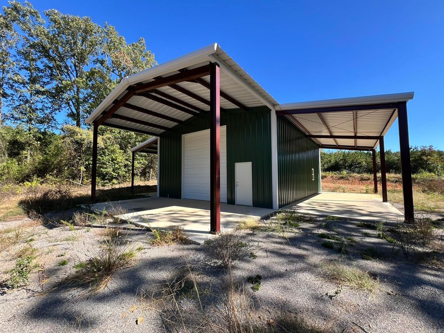 Skip the cost of starting from scratch—barn, utilities, and access already here. RARE 41.56± acre tract just north of Atkins, complete with a gated entrance, endless privacy, and a 30'×40' insulated barn ready for your vision. Whether you’re dreaming of a barndominium, a weekend retreat, or a turn-key RV/Shop setup, the hard work is already done.  The barn features full insulation, plumbing roughed in for a future bathroom and kitchen, and two 14' double doors with LiftMaster openers perfect for pulling in a camper, equipment, or recreational vehicles. Exterior wings expand the utility with two 14'×40' covered concrete bays and a 15'×30' covered porch, offering exceptional outdoor workspace or room for future build-outs.  The acreage is planted in row pine, with thinning projected in 2026 and an anticipated harvest around 2033 (buyer to verify). Enjoy a peaceful rural setting, income-producing potential, and improvements that fast-track your building plans.  This property checks all the boxes privacy, versatility, and value. Schedule your tour today and imagine what you can create here.