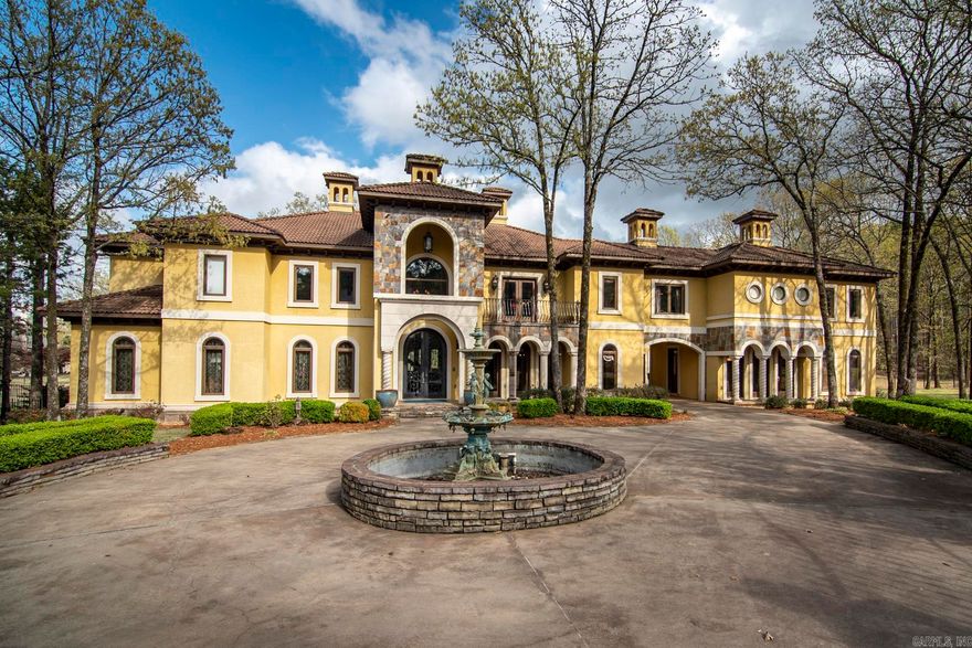 Nestled within the exclusive gated community of Valley Falls, this residence stands as one of the most spectacular homes in West Little Rock. This majestic European-style villa embodyies sophistication using refined materials and an unwavering commitment to detail. Boasting an expansive 8,833 (heated & cooled) square feet of living space, this residence is a haven of luxury and comfort. The grandeur is evident in every corner, from soaring high ceilings that exude a sense of spaciousness to meticulously designed large, formal gathering areas ideal for hosting grand events. Simultaneously, intimate spaces provide a cozy retreat within the lavish expanse of this estate. The outdoor sanctuary is an epitome of leisure and relaxation, featuring a beautifully landscaped backyard that unfolds as an oasis. A spacious pool invites refreshing dips, while the two covered porches and outdoor kitchen sets the stage for delightful gatherings and al fresco entertainment. Additional features include a four-car garage with a motor court.This residence transcends the ordinary, offering an unparalleled lifestyle within the coveted confines of Valley Falls. Additional lot next door sold separately.