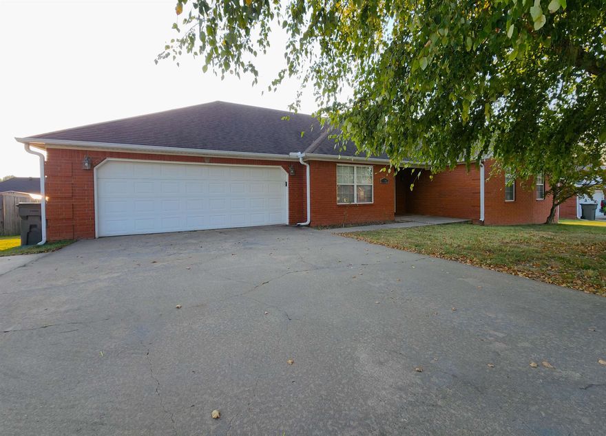 NEW ROOF will be installed on this 1721 sq ft home, designed for comfort and versatility. Upon entering, take a left and retreat into the room currently styled as a cozy library that's perfect for unwinding with a book, catching up on your favorite shows, or simply relaxing. From here, you can easily access the spacious kitchen, which boasts ample room to add a pub table or snack bar, creating an ideal spot for casual dining. The breakfast area is nestled by bay windows, offering a bright and cheerful space to start your day. For those who need a dedicated workspace, you'll find a convenient desk and pantry area leading to the laundry room. The primary bedroom features two large closets and an ensuite bathroom. The home's two additional bedrooms are situated at the front, benefiting from the eastern sunlight. Outside, the driveway includes an extra parking pad, perfect for an RV or guests. The backyard is large that contains two apple trees, blackberries, and a 10 x 16 storage building, providing plenty of space for your tools and hobbies. NEW ROOF coming soon!