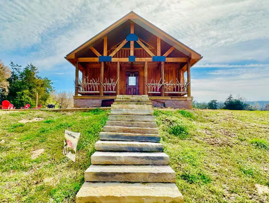 Income Producing, Turn-Key Airbnb Opportunity in Mountain View. This rare listing includes two cabins on 5 acres just 10 minutes from downtown. The main cabin, built in 2021, is a well-established short-term rental with a 90% year-round occupancy rate. It features a spacious primary bedroom, divided loft with two beds, and one full bath, sleeping up to 8 guests. The second cabin, completed in 2024, offers 1 bedroom, 1 bathroom, and is ideal for additional rental income, a guest space, or multi-generational living. Whether you're looking for an investment or a peaceful retreat, this property delivers. Enjoy world-renowned fishing on the White River, scenic hiking trails, and local festivals nearly every weekend. Relax under the stars or take in breathtaking sunrises and sunsets from the large outdoor decks. Owner has a transition plan in place for Airbnb bookings to smoothly carry over. Option to purchase just the main cabin and 1 acre – see MLS #25012901.