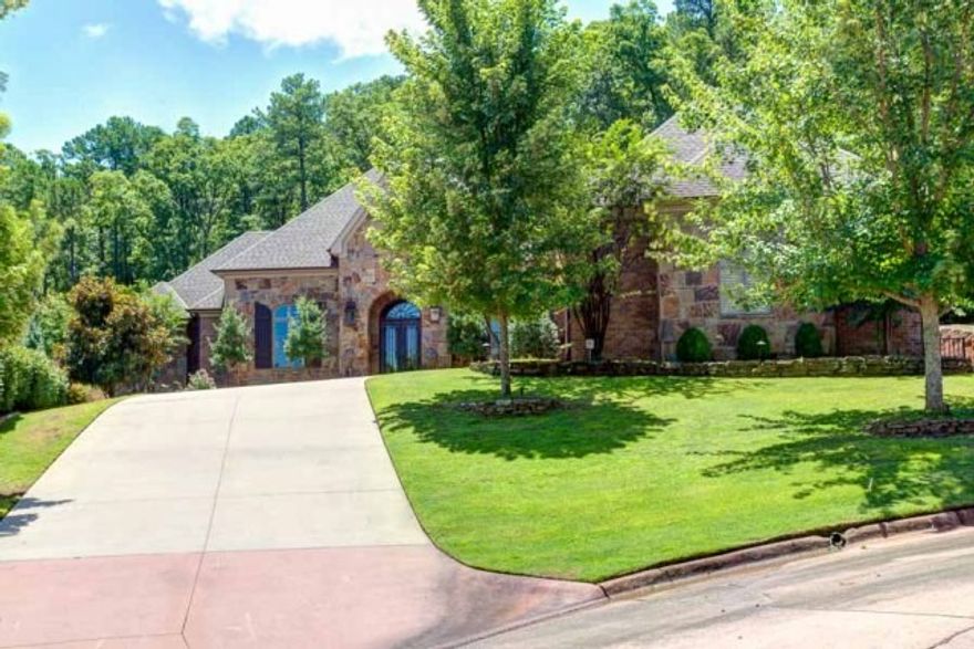 Timeless European architecture in this newer Hickory Creek home.  Quite cul-de-sac location and offers complete privacy. Native Ark. Stone covers the façade of the home.  Open spacious floor plan, lives like a one level,  featuring a foyer, formal living room, dining room, kitchen, breakfast, den with fireplace, paneled study, lg. master suite with fireplace and sitting area, two bedrooms with direct bath access.  Upstairs features a large media room, full bath and additional bedroom or exercise room.