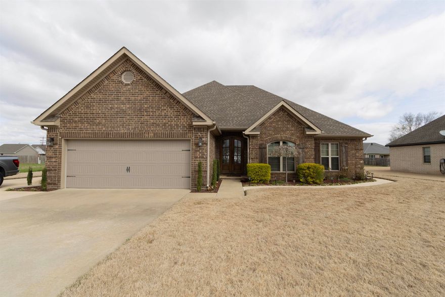 Just 30 minutes from Jonesboro or Paragould, this beautifully maintained 4 bed, 2 bath home offers the perfect blend of comfort, function, and style. Inside, you'll love the open floor plan, granite countertops, gas range, and ample kitchen storage. Cozy up by the gas fireplace in the spacious living room, and unwind in the primary suite featuring tray ceilings, double vanities, a soaking tub, walk-in shower, and his & her closets. The three additional bedrooms are tucked away on the opposite side of the home for added privacy. Step outside to a fully fenced backyard with a waterfall, covered patio for entertaining, and a 24x40 shop with vinyl flooring, 16' garage door, 8' bay door, and plenty of storage. A whole-home Generac generator ensures peace of mind during storms, and major systems like HVAC and appliances are just a few years old. If you're considering new construction, don't miss this oneit's packed with features you won't easily find in a brand-new build!