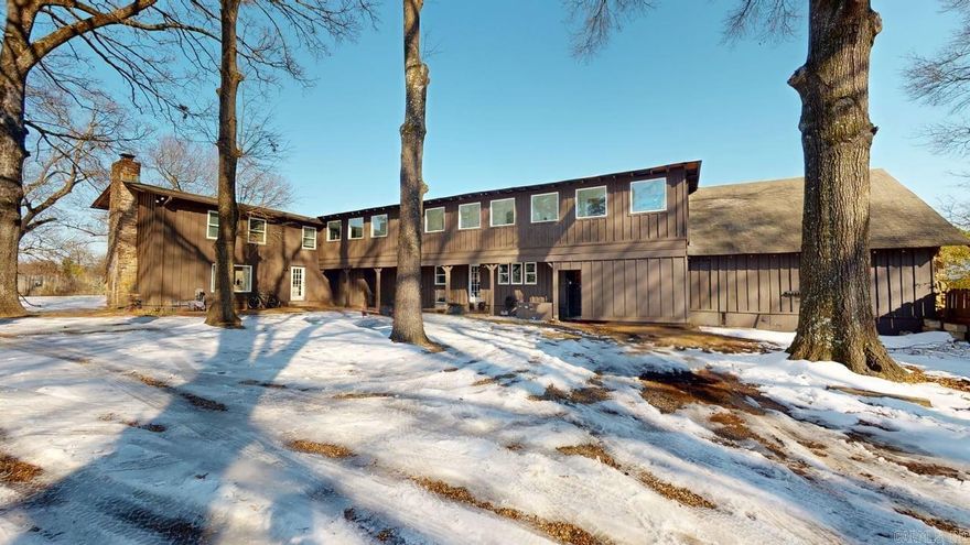 Over 6,100 sq ft of living space with 7 bedrooms, 6 full baths, and 2 half baths, including a primary suite on the main level. The flexible layout offers two full kitchens, two laundry rooms, multiple living areas, a great room, office/study, bonus room, and in-law quarters. Features include wood and tile flooring, walk-in closets and showers, a wood-burning fireplace. Enjoy large porches and outdoor living space. Level lot with ample parking. Currently being rented by the room for student housing. Lots of options to additional units. A unique property for investors, can be rented by the room or master lease.