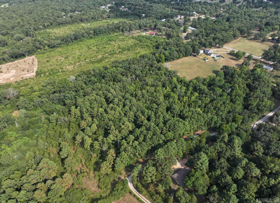 Check out this beautiful 5 acres of raw acreage out in the county. Located at a dead end road surrounded by woods, this property is very secluded. Public water and electricity are located at the road and fiber optic high speed internet is in the area! This land has no restrictions, the possibilities are endless! Type in 23 Briarwood Lane and this land is directly across the road.