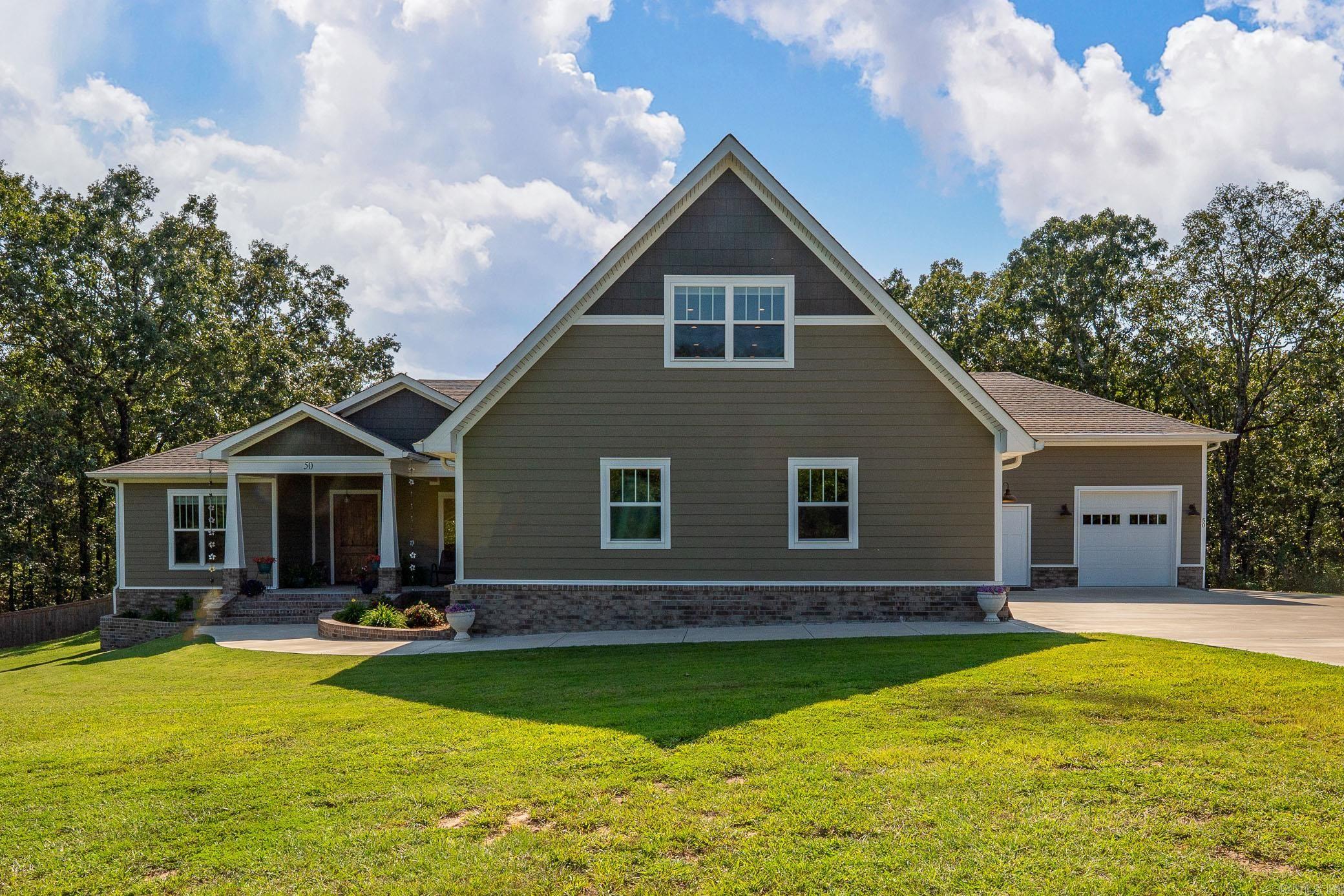 Beautiful 4-bedroom, 3.5-bath home with two bonus rooms plus unique extras, all on 5 private acres inside the gated Stone Hill Ranch subdivision. The inviting front porch leads you into a spacious foyer with a formal dining room. The large living room opens to the gourmet kitchen, complete with granite countertops, gorgeous backsplash, stainless steel appliances, double ovens, huge walk-in custom pantry & generous center island w/breakfast area. The primary suite is truly a retreat w/dual vanities, soaking tub, tiled walk-in shower & two large walk-in closets. There are two additional guest rooms on the main level that share a hall bath and a half bath, laundry room & mudroom. Upstairs offers a spacious fourth bedroom, full hall bath & oversized bonus room. Additional spaces include a 331 sq. ft. flex room w/full bath attached to the garage, plus heated & cooled utility/pet room w/backyard access & 4 car garage. Outside enjoy a fenced yard area, patio & great views of the beautiful surroundings.