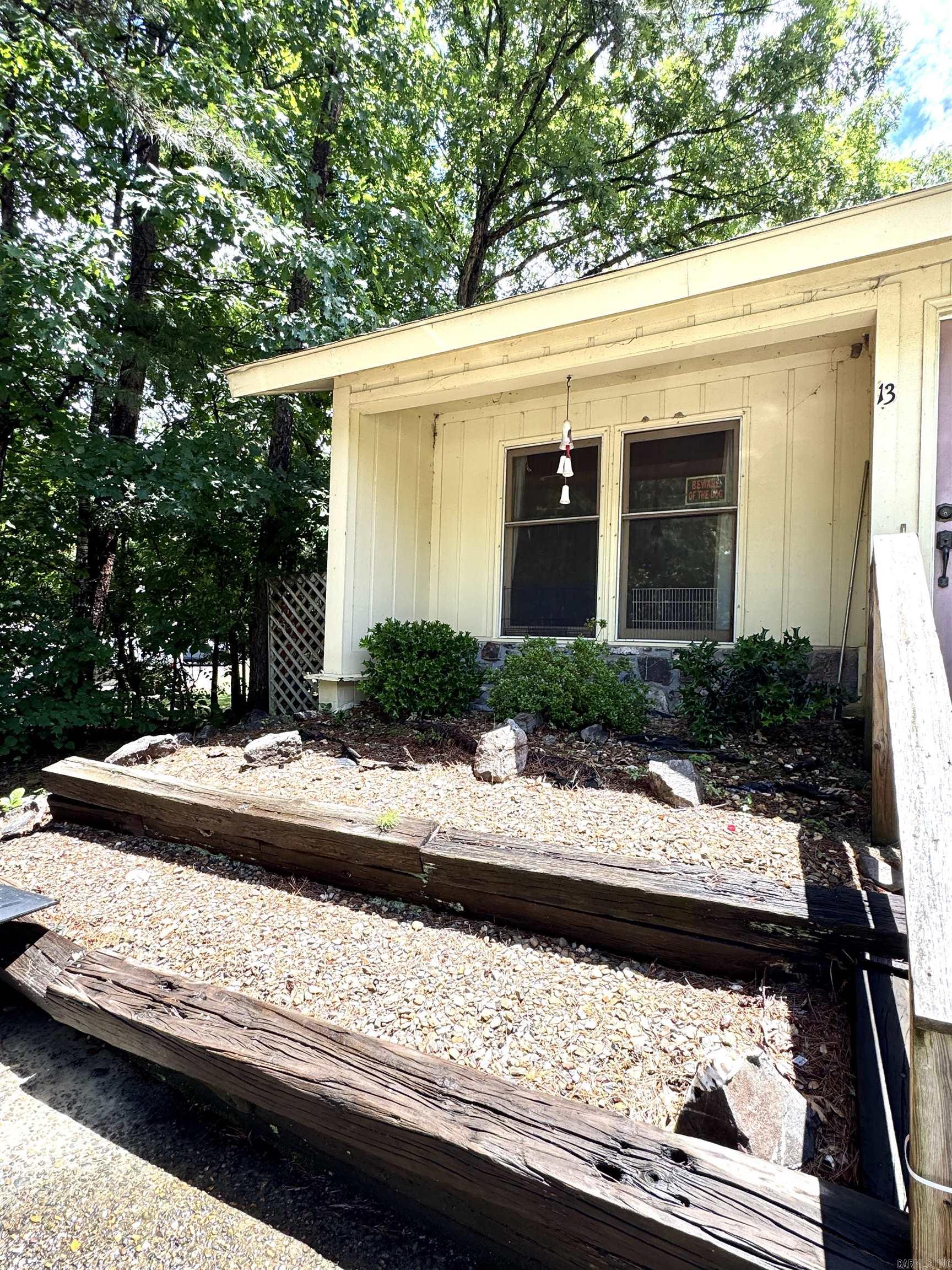 Fixer-Upper opportunity in the desirable Hot Springs Village community. This one-level, 3 bed, 2 full bath townhome is 1296 sq ft and located just 5 mins from the West gate. Flooring has already been removed everywhere except kitchen. Property is being sold as-is. Closing cannot occur until July 29 due to probate proceedings. First time HSV property owners are subject to one-time $2,000 buy-in fee to POA at closing. Are you ready to make this your next project?