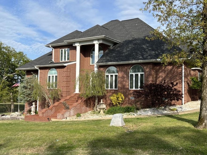 Colonial Magnificence with Turkey Mountain Golf… This 3 bedroom, 3.5 bath home provides gorgeous views of greens as it opens onto the veranda for outdoor enjoyment, while the basement provides added security and space. 9 ft. ceilings, granite, crown molding, hardwood, large kitchen with island, two wall ovens, spacious garage and golf cart storage highlights attention to detail, providing a balance of luxury and practical functionality.  The main bedroom suite is second to none. Then you will find the closets, added storage, partial fencing, utility room and extra space for your office with fiber internet. Whether at work, at play, for a few days or a lifetime, the opportunity is yours. Space for a crowd. Practicality for an individual seeking the peacefulness of Horseshoe Bend’s foothills of the Ozarks.