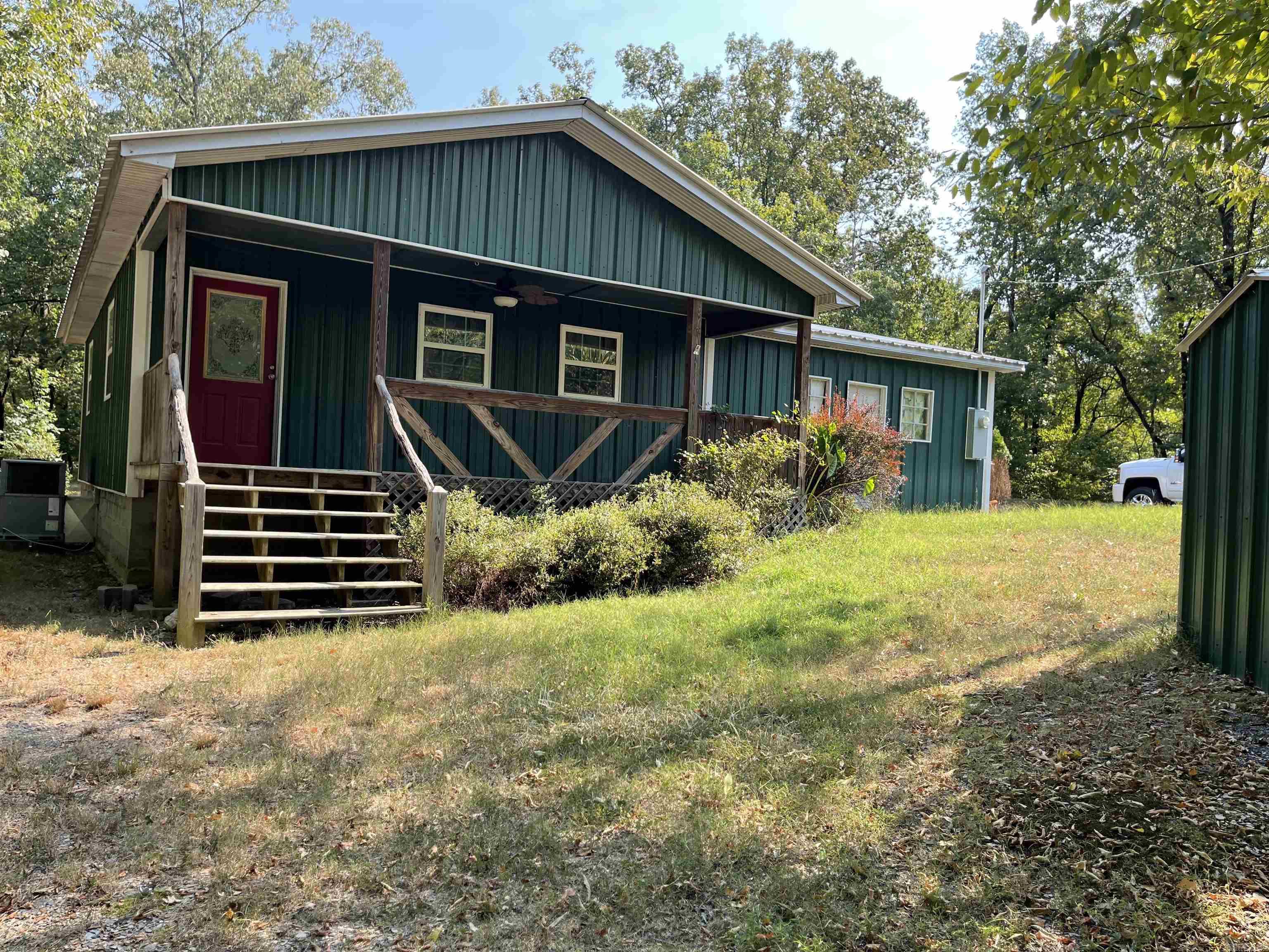 Great opportunity to get wooded acreage the Ferndale area for less than $200k. The house is an all metal, maintenance free exterior with an enclosed garage. The rear deck is a great place to watch wildlife on the 2.44 acres with over 500' of frontage on Bandy Rd. What a great started home or a place in the country for a senior independent living space. Many great new homes in the area are springing up so come watch this area develop into one of the more desirable Ferndale enclaves. Agents please see remarks.