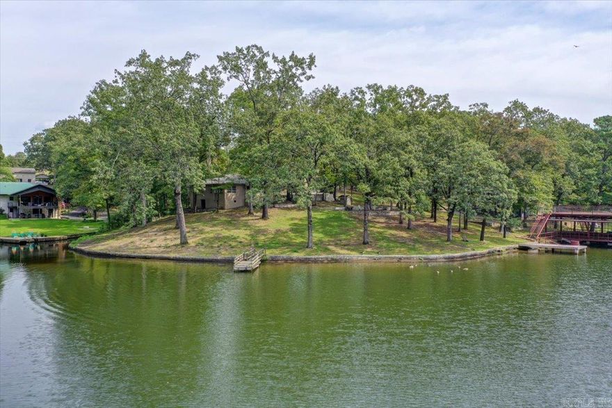 Here is a rare opportunity to own a unique property which has never been listed before!  This cute, cozy cottage was originally built in 1932 and come with 346 feet of beautiful, pristine shoreline and over a half acre of land that slopes gently to  Lake Hamilton.  Located in a large, quiet cove with year round water.  The possibilities with this property are endless! tenant occupied, 24 hour notice for appointments.