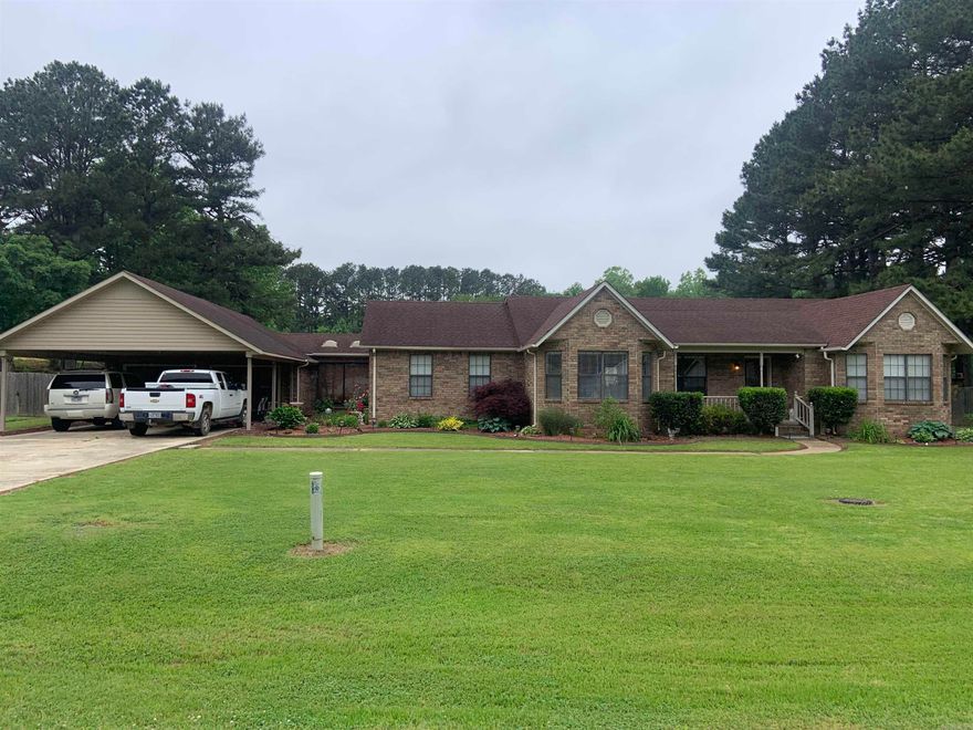 Beautiful large house with with 3 living areas. LR, Dining & Kitchen Combo, all remodeled w/all tile flooring in 2013. Kit. w/ breakfast bar and  Island w/sink. LR w/Fireplace insert & Vaulted ceiling.  Large Family Room w/ gas log FP that opens onto pool area,  bath w/walk-in shower that can be accessed from pool area. Large Den w/stained concrete floor. Vaulted office w/tile flooring. 13 X 26 ft screened in patio overlooking the 20 X 40 ft. in-ground concrete pool.  Two Separate outside bldgs plus a metal awning for storage. Wood privacy fencing on two sides of yard.  Gazebo in front yard.  See Agent Remarks