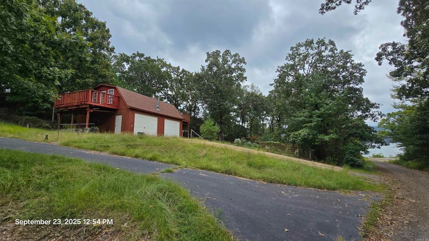 Lake front property ready for your adventures!   Property has a 2 car garage with apartment above,  a little tlc & youre ready to go.   The lot next door had a single wide mobile that will be moved.  Left behind is a paved circle driveway,  its own septic and utilities,  property overall has 2 septic, 2 water meters. Power meters!   Set up a new mobile, camper or build your lake home where the single wide mobile once set!  Neighborhood boat ramp just infront of this property & its 1 mile from Choctaw Public access.   Location is great!