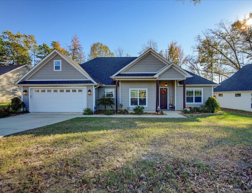 Like new but better!  This superbly kept & maintained home was recently purchased as new construction which used high end materials and lighting. It is not your typical "cookie cutter" subdivision home.  Large easy flow open floor plan with breakfast bar and room for casual dining as well as larger formal dining set.  Large furniture pieces are no problem with this spacious living room with fireplace. Sellers added improvements that include fencing and extra landscaping with cozy firepit in back.  Located in the award winning Lakeside School District & and just down the road from Garven Woodland Gardens and public access to lakes and parks.. In addition, this subdivision includes a walking easement to the lake.   Located as to be easy to quickly get to both Hot Springs proper and Interstate 30 in two directions.