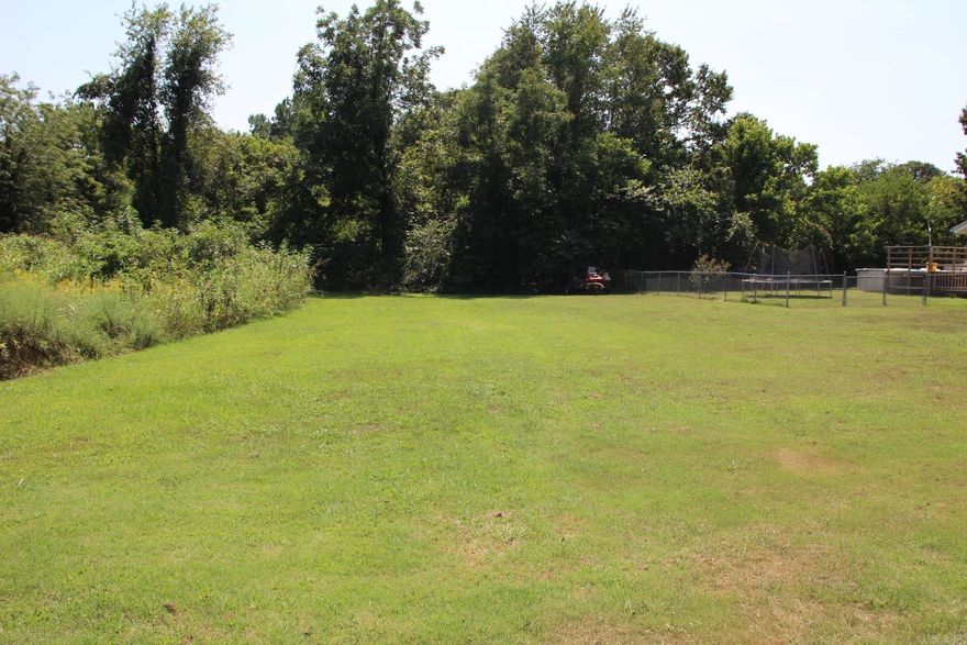 Nice level, unrestricted lot close to town, mobile homes & RV's welcome. Close to shopping and the Buffalo River. City water & electric at road, will need septic. Nice neighborhood close to main highway.