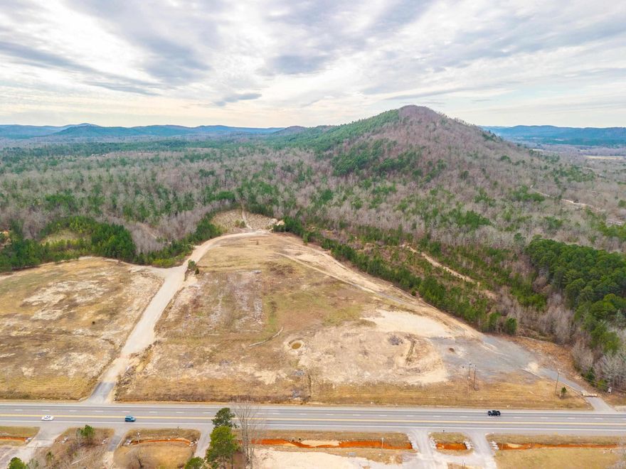 Approximately 199 acres of land, will possibly subdivide. 37.08 acres with approx 2288 ft of frontage on N Hwy 7 is flat, ready to build, and excellent for commercial development, with 25.22 acres directly behind. The remaining 136.77 acres would make a fantastic residential development with a preliminary plat already prepared with 15 lots. Lot sizes vary between 3.24 acres and 23.63 acres There is also approx 2186 ft of frontage on Goathill Rd. Electric, water and gas available.