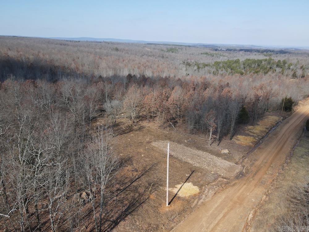 Excellent opportunity to own a secluded and rural building site with quality access, electricity on site, and access to rural water. I mean, come on, tracts like this do not come along often. This unrestricted land is comprised primarily of young timber and offers a wonderfully level topography, allowing for virtually any use and offering many building sites. Fronting the gravel county road with a newly constructed driveway already leading into the land, the groundwork for your new home is already underway. A small ravine runs through a portion of the land, providing just enough character for your enjoyment, and also carries water through the small seasonal creek for a portion of the year. Quality soil would be ideal if some clearing was done for the development of pasture to complete a small homestead or hobby farm. As mentioned, there isn’t really a limiting factor in what you do with your new homestead, as rural water is accessible across the county road. Additionally, adjoining land is available if more acreage is desired. The property is just outside the small area of Thida, less than 30 minutes from Batesville, AR, and only 15 minutes from the famous White River.