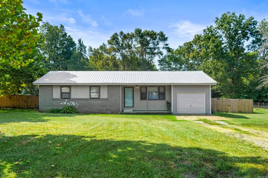 Looking for a place that feels like a cozy cabin but has all the modern updates? This 3 bedroom, 2 bathroom home was completely renovated and sits on a roomy half-acre lot with a fully fenced yard—perfect for kids, pets, or just enjoying some extra space.  You’ll love the warm, inviting feel inside, where everything feels fresh and brand new, while still keeping that rustic cabin feel. The metal roof not only looks great but will last for years to come.  Whether you’re relaxing on the porch, starting a garden, or hosting friends, this property gives you plenty of room to spread out and make it your own.  All the hard work is done—just move in and start enjoying your new home!