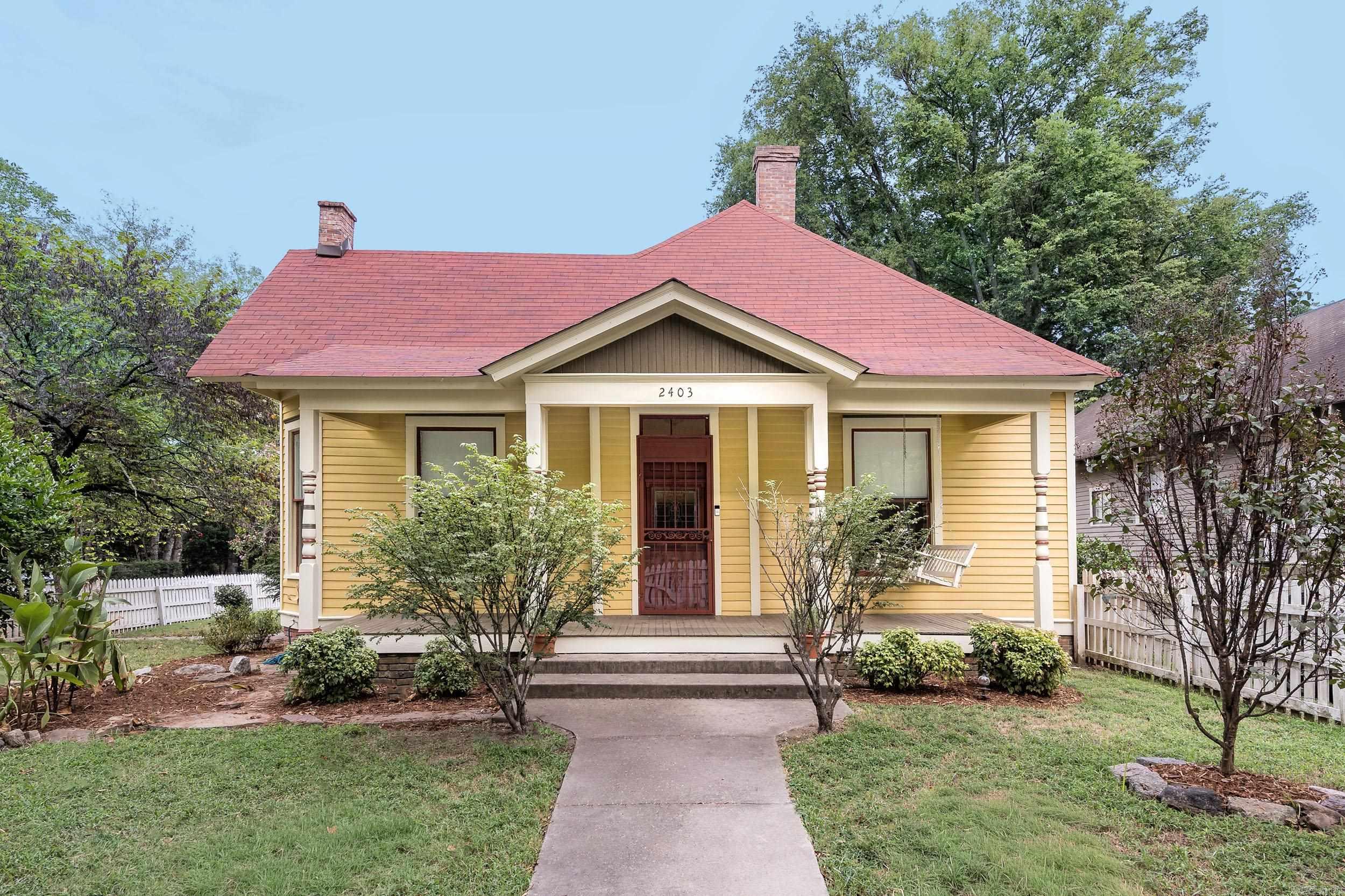 Own a Piece of Little Rock History! Step into timeless charm with this beautifully maintained historical home built in 1930. Bursting with character and curb appeal, this property showcases tall ceilings, ornate moldings, detailed trim, and hardwood floors throughout. The inviting front parlor, complete with pocket doors and a cozy gas fireplace, offers versatility as a third bedroom, home office, or sitting room. The newly renovated full bath features a stunning spa-like shower, while the updated kitchen is outfitted with butcher block countertops, stainless steel appliances new sink, garbage disposal and dishwasher in 2025. A separate laundry room provides direct access to a private deck, perfect for entertaining or relaxing. Enjoy the classic white picket fence enclosing the fully fenced yard, ideal for pets or gardening. Thoughtful updates include: Roof (2020) Exterior Paint (Sept 2025) Water Heater (2018) HVAC (2016) Bathroom remodel (2021) New Deck (July 2025) Powder bath updated in 2023 Move-in ready and rich in history, this home offers the perfect blend of historic charm and modern comfort. Schedule your private showing today!