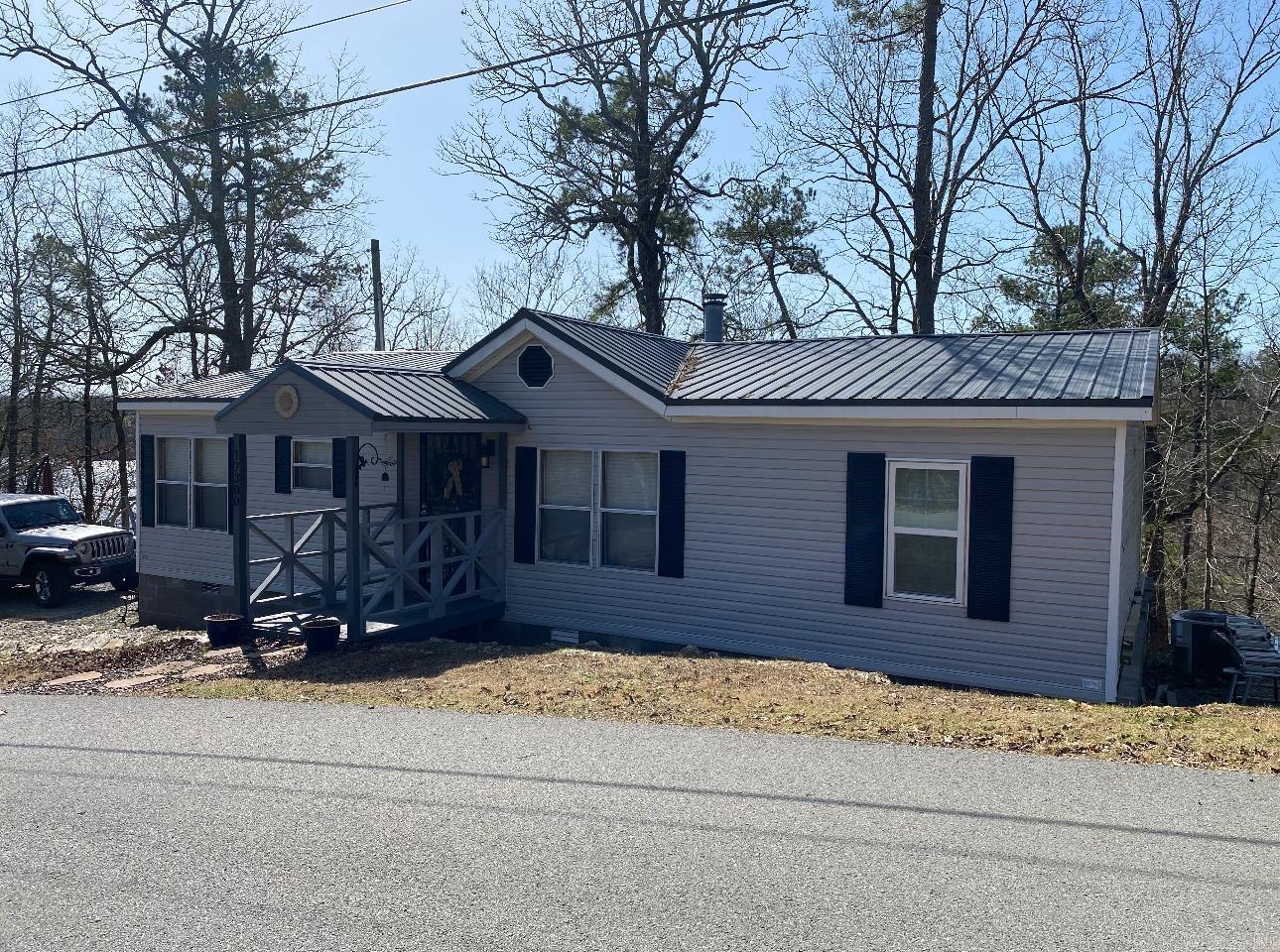 On Lake Norrell!! Come see this well maintained, 3bed/2bath mobile home surrounded by gorgeous lake views. This home sits on a permanent foundation, has all electric, with a wood burning fireplace. Newer roof (6years old) and HVAC (2023). Small shed with lean-to. Whether this home is a seasonal home or your full time home, you will fall in love with it and its location. Don't miss this opportunity! Agents, see remarks for more information.
