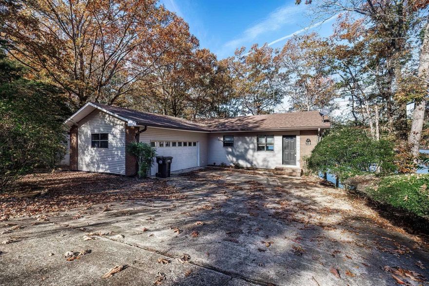 Lake DeSoto water front property with big water view! Walk in and you will see the potential of this home that is in good condition, updating will enhance the view. Beautiful sunsets from every bedroom and sunroom. This 3 bedroom 3 bath home is just waiting for the new owner to begin enjoying life on the lake! Covered boat dock. Vinyl siding and sunroom added to home. Carpet and laminate flooring replaced. LOMA and Elevation in documents. Square footage from Stone Appraisal in documents. Roof 2018. NO SELLERS DISCLOSURE. AGENT REMARKS