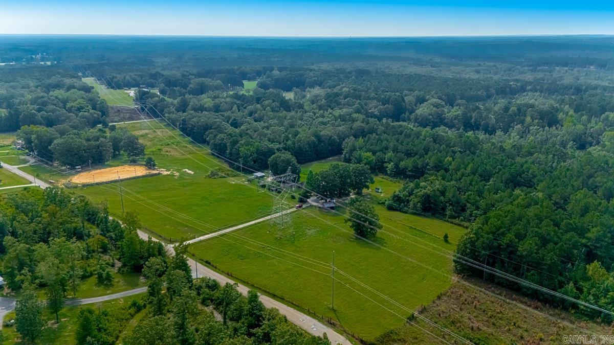 12.52 acres with home & Equestrian/Event Facilities. Bring your horses, cattle or big ideas! This 12.52 acre property offers a spacious 4 bedroom, two-bath manufactured home with a large deck featuring a pool cut-out, perfect for summer entertaining. All Kitchen appliances and Washer and Dryer to convey, all appliances except dishwasher are 2 years old. Air Unit if 4 years old. Equestrian and livestock ready with two separately fenced pastures, two horse barns and feed barn with electricity. For events and recreation, you'll find a large lighted area designed for rodeos, riding or even baseball practices. Amenities include, Bleachers, an announcers stand and electrical access for concession stands. Conveniently located only 1.5 miles from I-30, making for an easy commute to Little Rock or Hot Springs National Park. This unique property offer the perfect blend of comfortable living, livestock amenities and recreational opportunities- ALL in one location. Property tax is full amount including the homestead credit. Both Glen Rose and Malvern School Busses run on Glen Rose Road.