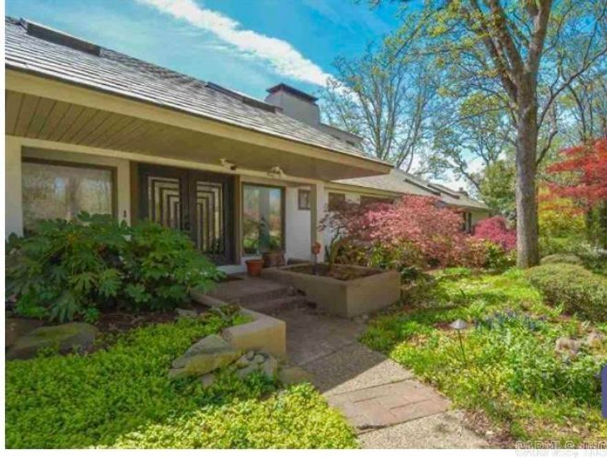 This absolutely gorgeous home has many updates and renovations to include new flooring throughout the property.  This home has been beautifully maintained. Home features a chef kitchen to include 8 gas burners, bulit-in fryer, center hood, large pantry and utility room, a theater room with projector and automatic large screen, sunrooms, exercise room, deck on each level of the home.  Large spacious living area featuring a large fireplace and big windows that provide views of the city and surrounding neighborhoods.  Each bedroom features a living area and balcony. There is a nice in-ground pool and Koi pond in the beautiful, landscaped backyard.  There is a pool house, wine room, built in fish tank. weight room, the master bedroom has very large walk-in closets that are absolutely amazing, office, foyer. This home is a must see.