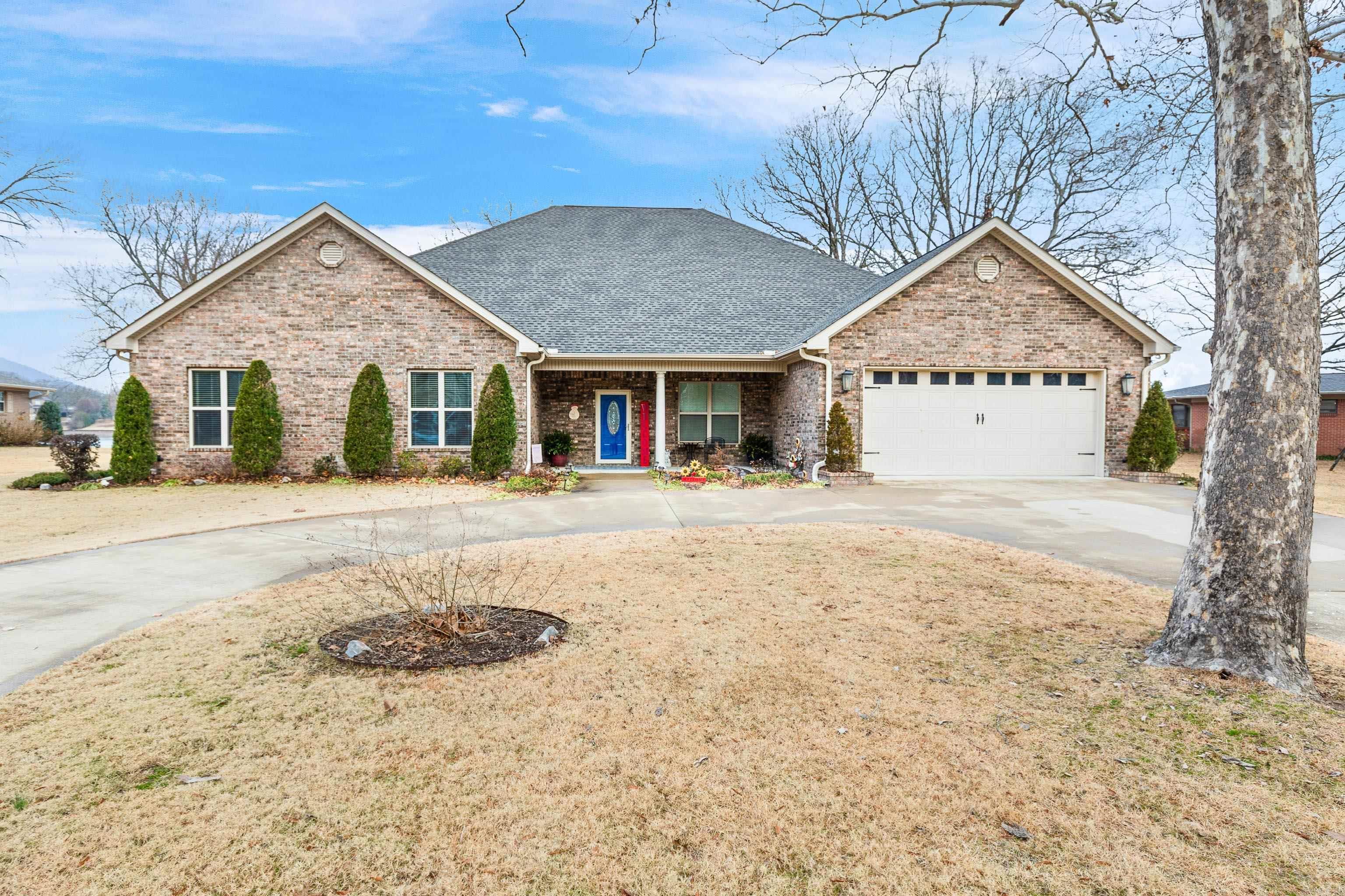 Welcome to this newer waterfront home located in Caroline Acres on beautiful Lake Hamilton. This custom home sits on .70 flat acres with 154' of private water frontage offering captivating views of the glistening waters. Exterior features includes private (permitted) covered boat dock, covered pergola, fire pit with built in seating, an additional concrete pad for lounging, concrete walkways to the lake and dock, 2 large covered patio areas off the house, and a 16x40 shop with 2 roll up doors as well as electricity. From the moment you walk through the front door, you are greeted with a view straight out to the water, taking your breath away. With a spacious living room, dining room, and kitchen combo, this home is perfect for entertaining and family gatherings. A 14x21 sunroom located off the living room boasts soaring lake views year round. In this one level home you will also find 4 generous size bedrooms, all with walk-in closets, with 2 of those bedrooms having private full baths. Other interior features include a small office with built-ins, an 11x11 office or craft room and a safe room located in garage. All the storage you need, whole home generator and more! See Remarks