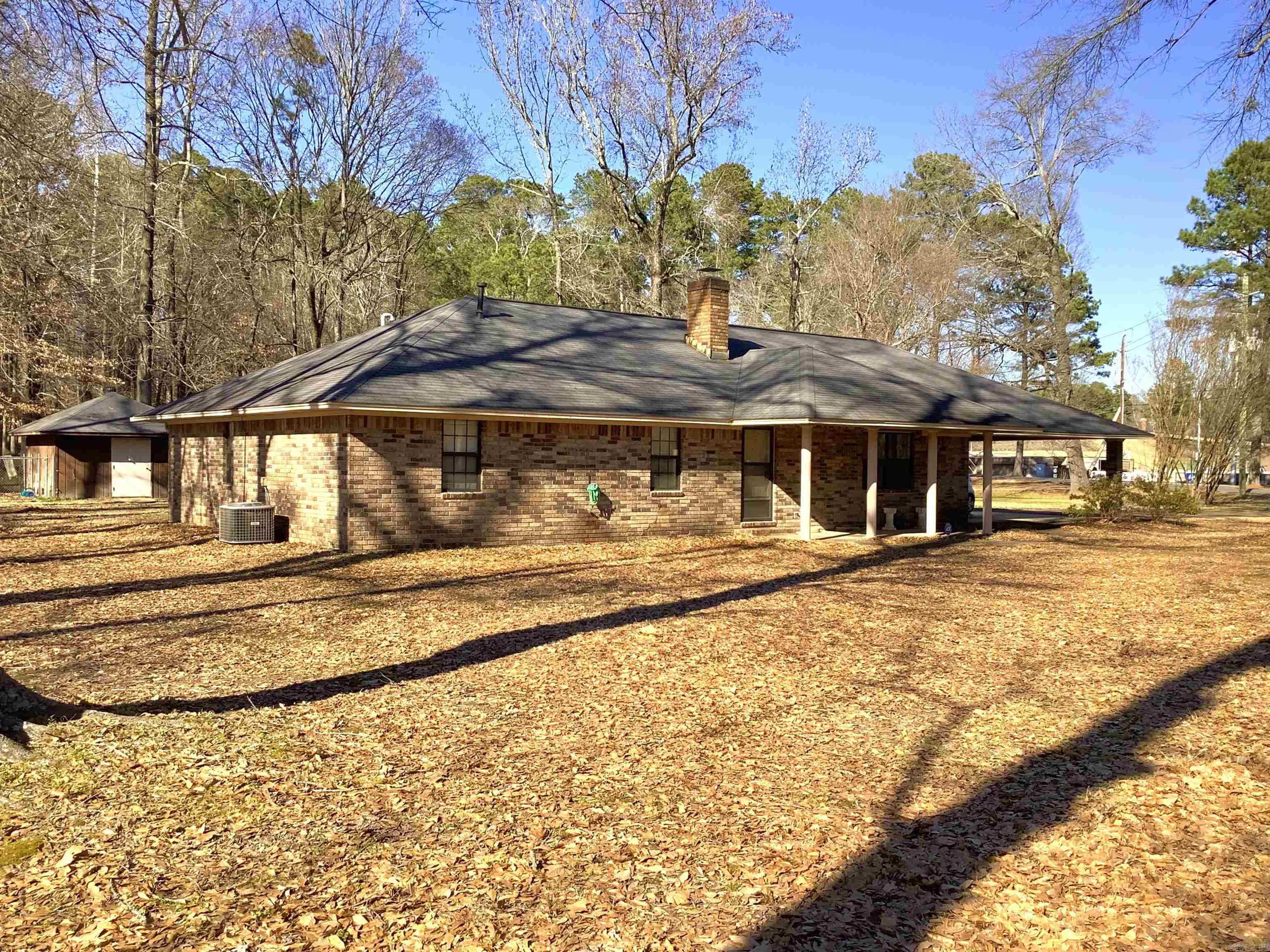 Custom built brick home on 1 acre corner lot close to a variety of recreational activities. Inside you will find a charming brick entry way that adds character with a welcoming vibe. Bricks lead to the grand wood burning fireplace with insert that provides heat, ambiance & nostalgia. The large eat-in kitchen has plenty of cabinet space and is situated next to the formal dining room with sliding glass door. Master bedroom is oversized with full bathroom and walk-in closet. Laundry room/mud room with front & back entry has utility sink. Outside storage building has been converted to dog kennel. Bonus room off carport could be craft room/workshop/storage. Area amenities include dog park, fitness trails, quick access to Henderson State University Campus + more. Prime location for off campus student housing.