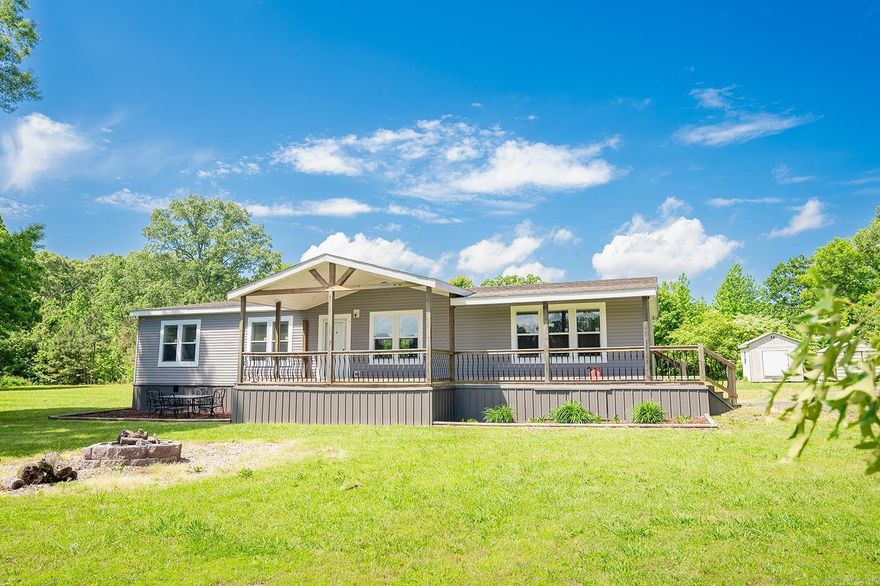 2020 Sunshine Double Wide Mobile home on 15 acres with pond! Permanent Foundation: Concrete runner, metal strong skirt underpinning.   Whirlpool Appliances.