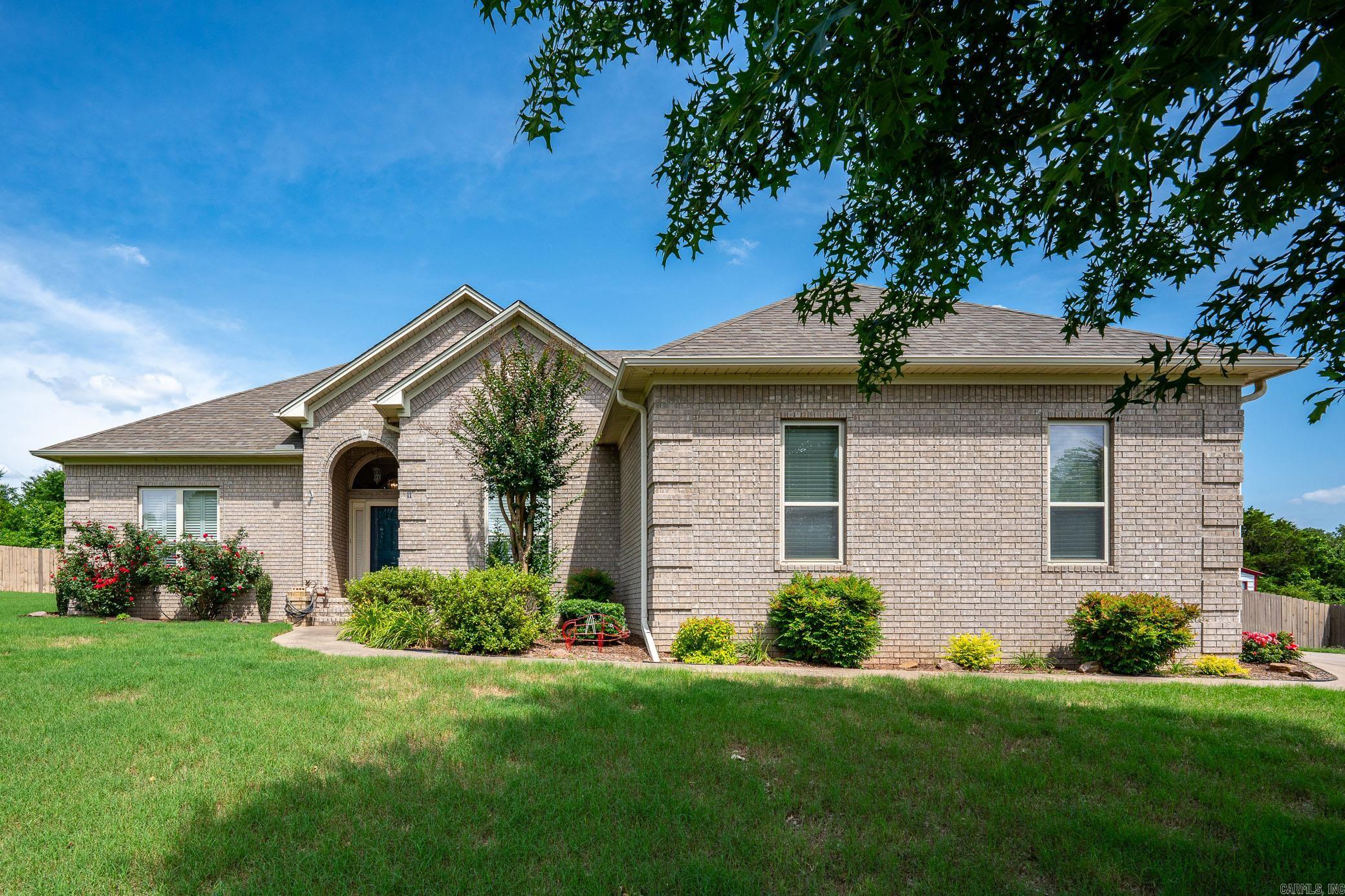 Incredible updated home on .51 acres. Updates include: luxury Vinyl plank floors, paint, quartz counters, plantation shutters, Roof (2022), HVAC (2024 new condenser & coil w/ 10 year warranty), Tankless water heater (2024). Large open living room with Gas fireplace, tall ceilings, & built ins. Separate dining room with large beautiful front facing window. Eat in kitchen offers Quartz counters, tile backsplash, stainless steel appliances including fridge, Cabinets with pull out drawers, pantry, broom closet, floating shelves in dining room. HUGE primary bedroom is on one side that has walk in closet in bedroom. Adjoining bathroom offers TWO additional walk in closets, jetted tub (jets do not work) w/ tile surround, walk in shower, & double vanities. Laundry room outside primary bedroom. Opposite side of house offers two guest bedrooms w/ great closets & full bath w/ double vanity. Don't miss the hidden room off the covered back patio. This heated and cooled room is apprx. 160 sq ft. and not included in the overall sq. ft. of the house. Could be used as office, storage, she shed, or pets. Fully fenced backyard, iron gate, side entry 2 car garage top of this perfect house.