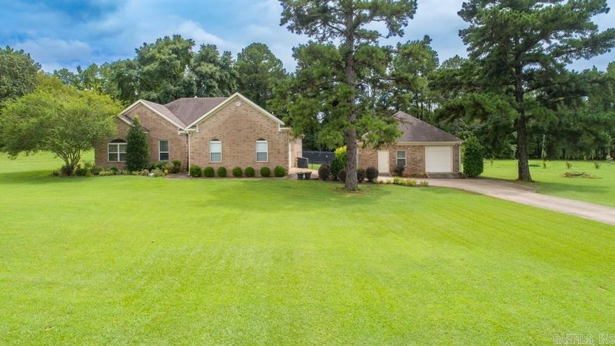 4 bedroom 2 bath or could be 3 bedrooms with an office, nice kitchen with granite tile countertops, plenty of storage, master bath has double sinks, stand-up shower and jacuzzi tub, enjoy the screened in sunroom off back porch, safe room in the garage, 27x30 heated and cooled shop, sitting on 1.5 acres. Come see this one today!  Fence panels do not convey. See agent remarks!