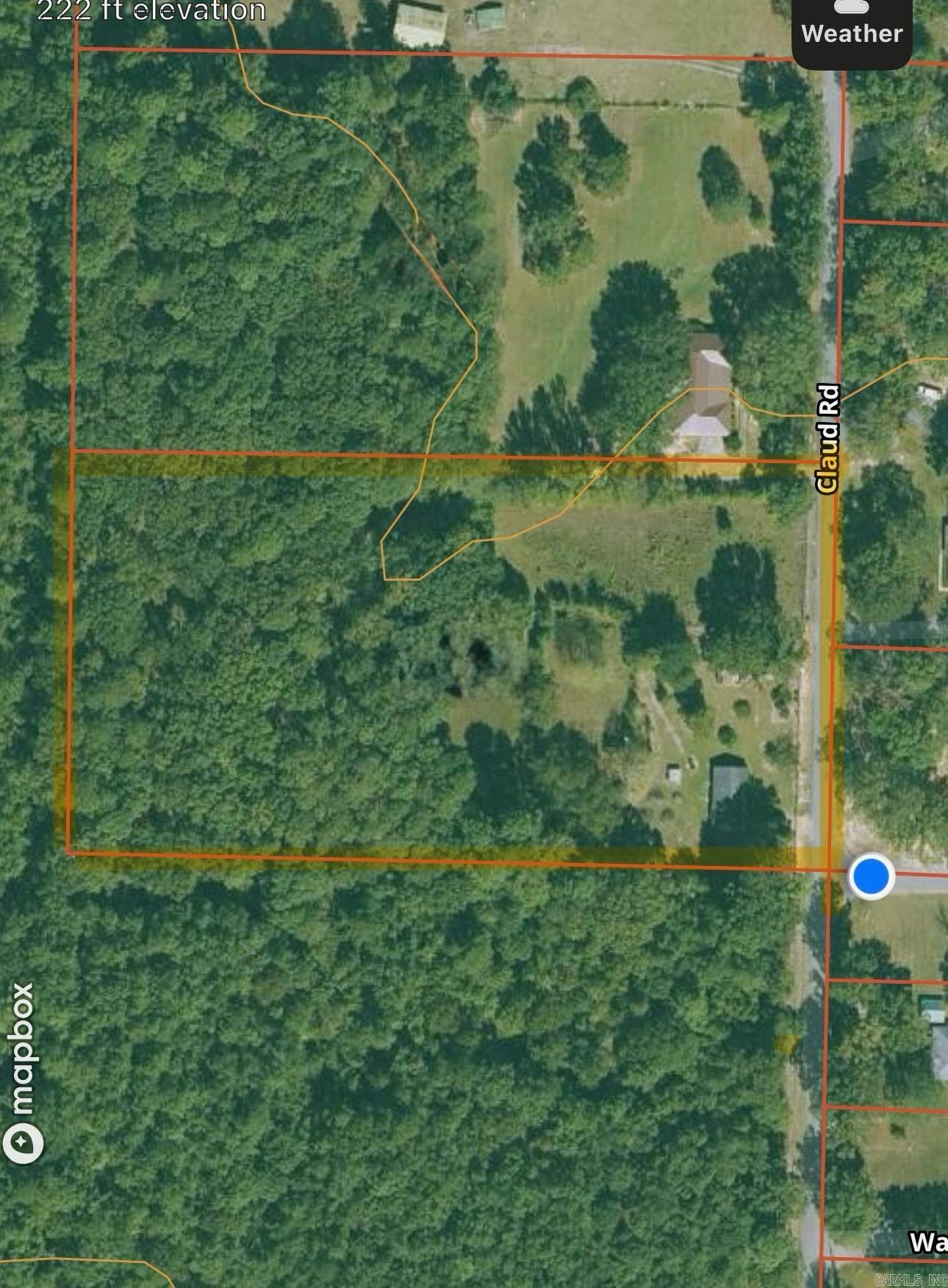 Discover the perfect blend of privacy and convenience with this beautiful 5.12-acre tract of land, located just minutes from town but outside the city limits. Partially cleared with mature timber on the back half, this versatile property is ready for your vision whether you're a homeowner looking to build your dream home or an investor searching for your next project. With utilities already on-site and two septic tanks installed, the groundwork is set. There are two non-livable structures offering potential for rehab or removal depending on your development goals. Buyers ready to build a custom home on a spacious and serene lot or investors interested in subdividing for new construction homes or rental properties, don't miss out on a prime piece of land with endless opportunities.