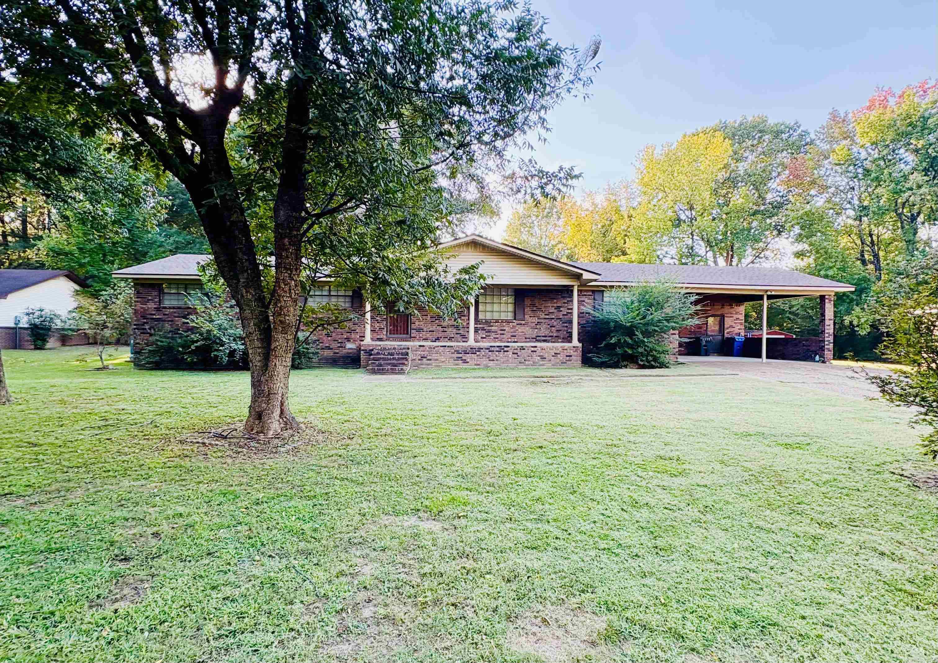 This 4 bedroom, 2 bath home in Jonesboro sits on a quiet, shaded lot and offers plenty of space inside and out. Features include a large living area with a brick fireplace, beautiful wood floors, an updated primary bath with a walk-in tile shower, and a spacious walk-in closet. Out back, you'll find a big yard and a large shop. Perfect for storage, hobbies, or extra parking. This home won't last long! Call today for a private showing!