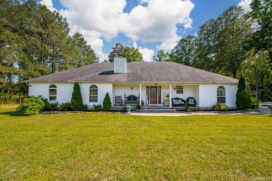 A must see in the East End/Sheridan school district! Three tranquil acres in a gated neighborhood with multiple outdoor spaces for relaxing entertaining. The peace of country living, with easy access to all major shopping areas. 17 min/East End, 20 min/ Bryant, 22 min/West Little Rock, 27 min/downtown Little Rock. Outside features an inground pool (new liner in 2023) with a diving board and covered deck (rebuilt in 2021). Huge firepit for bonfires with a stockpile of seasoned wood. 1 acre yard, with 2 acres of woods and picturesque creek and bike trails. Established garden already planted for summer harvest! Includes cutting flowers, perennial fruit (strawberry, blueberry, blackberry, mulberry) and herbs. In-ground tornado shelter and small orchard in front yard (apple, fig and pear). Inside boasts an open floor plan, with a vaulted ceiling and woodburning fireplace in the living room. Kitchen has been updated this year with new granite countertops, refinished cabinetry, new sink/faucets, stainless hood vent & new double oven/range. 5 spacious bedrooms 3 baths. Bedrooms are oversized with lots of closet space. New floors and roof in 2017. There was an addition completed in 2018.