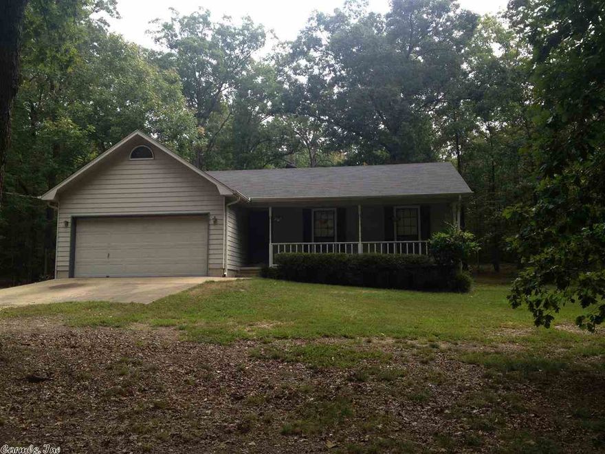 3BR 2BA on beautiful 2.5 acres in Crystal Lake Sub. Home is on two lots.  Wood floors and fireplace in living area.  Roof was replaced in 2009. Large deck and storage building in back.