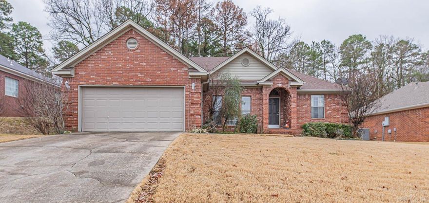 Welcome Home! This 3 bedroom 2 bath home is waiting for you! It features a beautiful kitchen that has recently been upgraded with gorgeous new granite, stove and microwave. It features a split bedroom floor plan that is great for entertaining and day to day living, it also has a separate dining room or could be used as an office. The master is ample in size and the bathroom features a large jacuzzi tub, separate shower and large master closet.  The backyard features a patio and you feel completely secluded in the woodsy surroundings. The main living area is spacious and open and the floors have been recently updated. The only thing its waiting for is you!