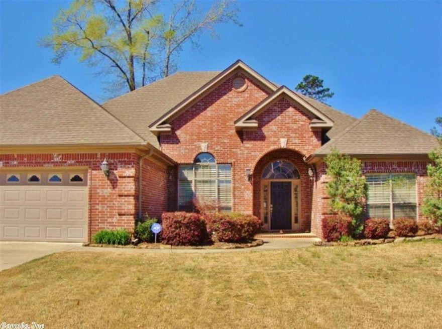 This beautiful home has an open floor plan with warm hardwoods in the entry foyer, formal dining area, hallways, kitchen and hearth room.  The large and welcoming living area has a see-through fireplace which opens to the cozy hearth room.  Dream kitchen features tons of spacious cabinetry, granite counter tops and island.  Beautiful crown moldings with soaring ceilings.  Tray ceiling in the large master bedroom.  Large level backyard, covered patio, privacy fenced backyard borders greenspace.   2876 Sq Ft