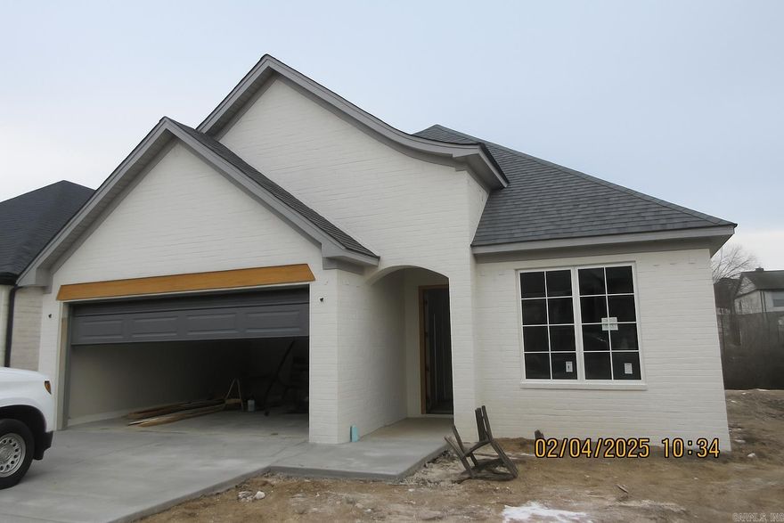 The community offers a peaceful, tucked-away setting while keeping you close to your favorite shopping and dining spots in West Little Rock. One of the best parts? You’ll never have to mow again—lawn care is covered with your yearly fees. This home features 3 bedrooms and 2 full bathrooms. The chef’s kitchen includes a walk-in pantry, a large center island, and opens to a spacious living room with a built-in fireplace. The primary suite features high vaulted ceilings and a spa-like bathroom with a walk-in shower and a convenient master closet-to-laundry connection. Additional highlights include a two-car garage and a covered back patio accessible from the private drive. Each unit is separated by fire walls and sound cavities for a quiet, private feel. Get in early to make your interior selections. Estimated completion: March 2025.