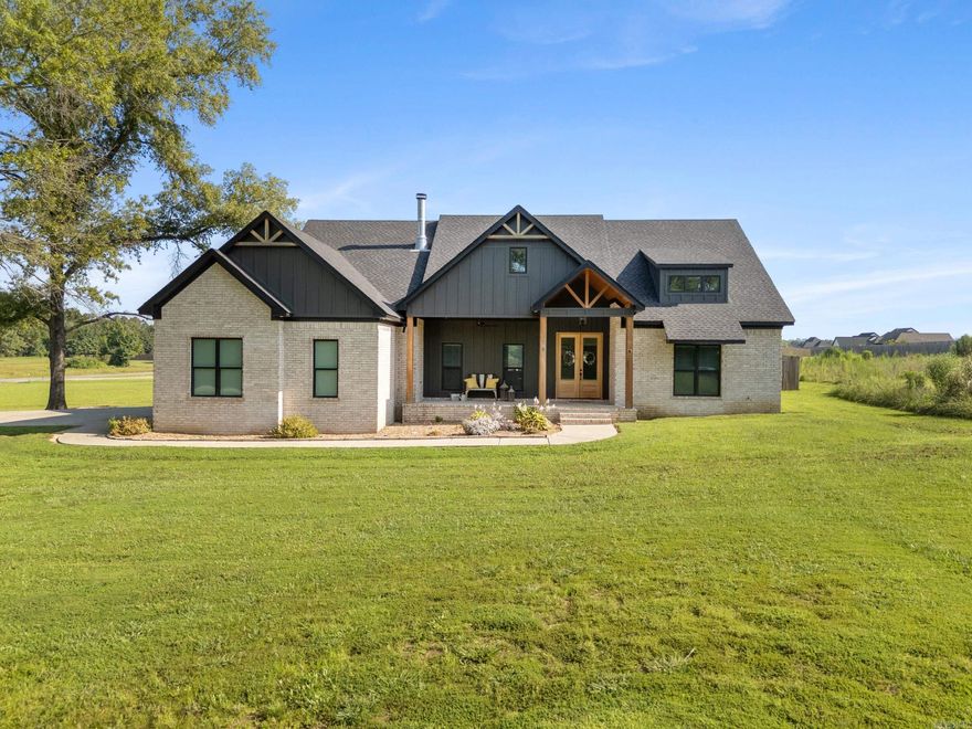 This 3 bed, 2.5 bath home, sitting on 2 acres, is CUSTOM in every. single. way. From the moment you walk up to the large front porch, the details of the tongue and groove wooden ceiling, double doors, and space to sit and enjoy, will make you want to stop and stare! The large living and dining space seamlessly flow together with custom floating shelves, a gorgeous woodburning fireplace, wooden beams accentuating the vaulted ceiling, and just WAIT until you see the kitchen! Open to the main living area, the kitchen is a showstopper! Double ovens, a pot filler, a farmhouse sink, tons of cabinet space, leathered granite countertops, and a pantry of your dreams await you! The split floor plan features a master suite with access to the backyard, large vanity spaces, a saferoom closet, a gorgeous walk in shower, and a surprise for the guys!!! It's a first for me... A discreetly built-in urinal!!!! Ya'll!! The back porch. The details. The woodwork and beams!!! You can even access the 1/2 bath from the back porch! Talk about convenience! The sellers put years of dreaming into this floorplan! Come see why this is one is going to check all of your boxes!!!!!