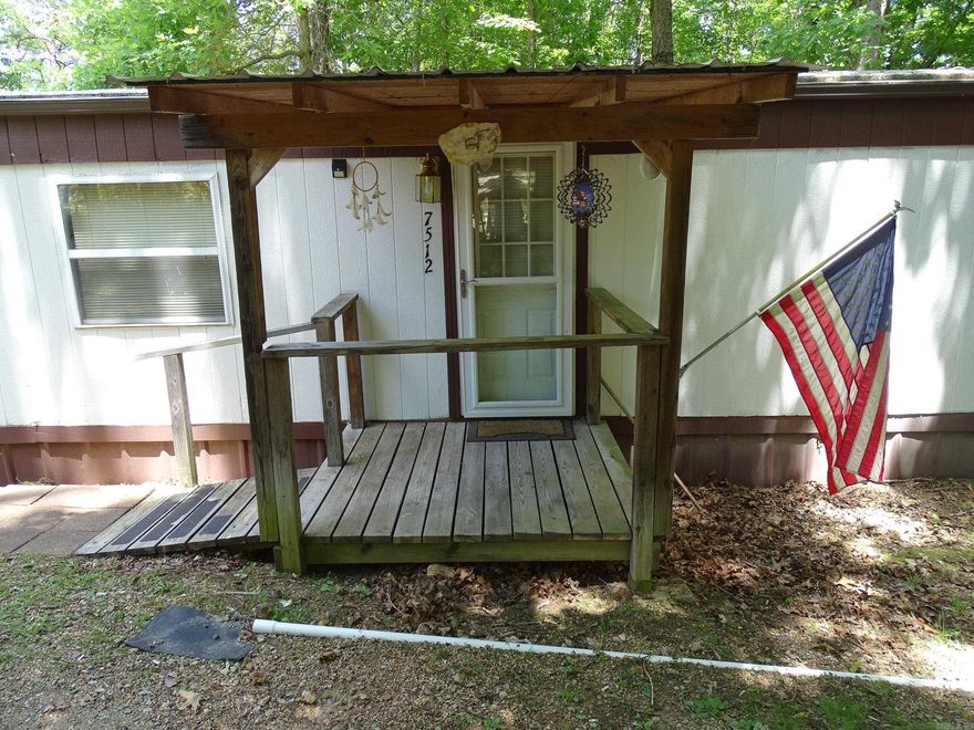 Location, Location, Location!!! Are you looking for a nice spot to park the RV and enjoy the great outdoors? Located a few short miles from the Buffalo National River, this single wide trailer on 2AC M/L has 2BR's, 1BA, and a tall RV carport with water, electric, and a cleanout at the spot. There is also a single car carport, two outbuildings for storage, a 500 gallon propane tank that is owned, and much more! This one won't last long. Don't let it get away!