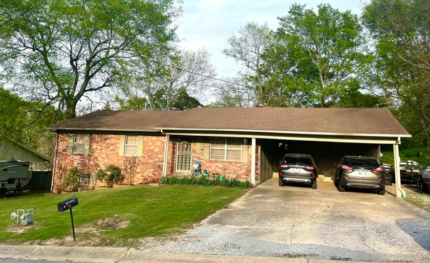 This charming 3 BR/ 2 BA home boasts 2812 sqft+/- of heated and cooled space in the heart of Pocahontas.  The main level consists of 1536 sqft+/- and is home to all 3 BR/ 2 Bs.  The extra large living area is adorned with new LVP flooring and features a beautiful gas log fireplace. Your kitchen is spacious with beautifully painted cabinetry, a breakfast bar, and unobstructed access to the dining area.  The Master bedroom featuring an on-suite bath, provides ample room for your entire bedroom suit with room to spare.  Access to the covered patio area, perfect for grilling and gatherings, is just off the dining room through the sliding glass doors. The home has upgrades that include the new LVP flooring, new interior doors and stylish new entry door from the 2 car carport. The remaining 1276 sqft +/- is in the form of a heated and cooled walk out basement.  The basement area is unfinished and currently serves as a work area and extra storage. This could easily be finished and converted to extra living space.  This home has CH/A, with the heat being natural gas, gas cook stove and gas hot water heater.  The brick and vinyl exterior provide for little maintenance for the new owner.