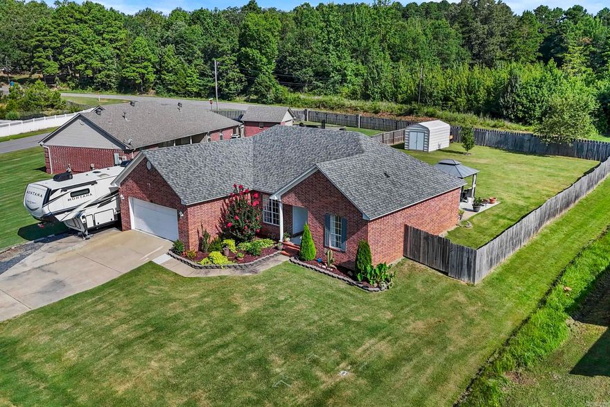 Tucked away in the quiet and private Wilhelmina Cove neighborhood, this charming all-brick home offers a rare mix of comfort and convenience. Enjoy exclusive access to a neighborhood boat ramp and a pavilion by the water—perfect for weekend getaways without ever leaving home. With easy access to the interstate, commuting is a breeze. Major updates include a new roof and HVAC in 2019, and a brand-new water heater in 2024. Inside, you’ll find an open floor plan with gorgeous stained concrete and wood floors, a cozy gas log fireplace, and plenty of natural light. The kitchen features a sunny breakfast nook and a separate formal dining area for entertaining. The home also includes a double car garage, a shaded pergola over the back patio, and a school bus stop conveniently located on the corner. Don’t miss your chance to own in this hidden gem of a neighborhood—schedule your private tour today!
