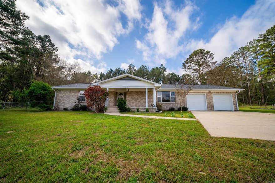 Welcome to your perfect blend of space, comfort, and versatility. This 2,373 sq ft brick home sits on a stunning 6.03 acre tract, offering the privacy you have been dreaming of but still located close to town. Featuring 3 spacious bedrooms and 2 full bathrooms- this home also offers a bonus bedroom and bathroom- ideal for mother-in- law suit, guest quarters, rental opportunity, or the ultimate man cave. Inside you will love the updated granite countertops in the kitchen, along with refreshed bathroom vanities and stylish new flooring. The fresh paint gives the home the clean, move-in ready vibes we all want.  Enjoy your morning coffee or unwind in the attached sunroom overlooking peaceful acreage. Step outside and take in the beauty of your own pond. The property is just as impressive with a shop, covered Rv parking, 2 car garage with new doors, and a brand-new roof in 2023.