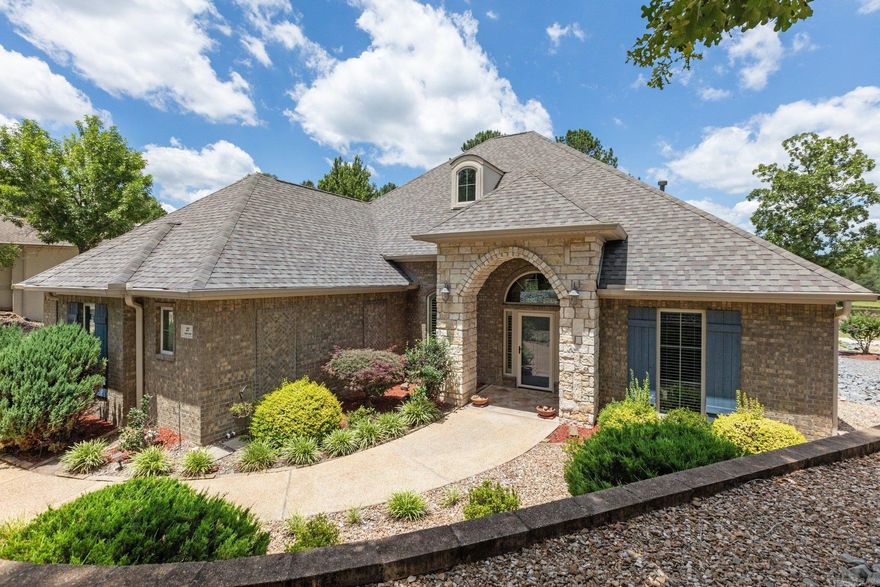 Welcome to this immaculate, beautiful, single story 3 beds 2.5 bath home! Located on the greens of Isabella Golf Course in the beautiful community of Hot Springs Village - this spacious home offers 2,714 sq. ft of comfortable living space. This home has a spacious kitchen which opens up to the living room, is equipped with custom cabinetry, granite countertops, abundant storage, and stainless appliances. Hand-scraped hardwood flooring throughout main living and crown molding flows seamlessly throughout the rest of the house. The spacious master suite features a walk in shower, a his-hers vanity, and a spacious walk in closet with built-in shelving. A Jack-n-Jill bathroom connects two secondary bedrooms on the other side of the house. Step outside & enjoy the spectacular outdoor views on your large, extended back porch. The oversize, side-entry garage offer plenty of room to park your cars and golf cart, while the floor-in attic space offers extra storage space or you can finish it out and make it a great game area. Must see home! Agents see Agent Remarks.