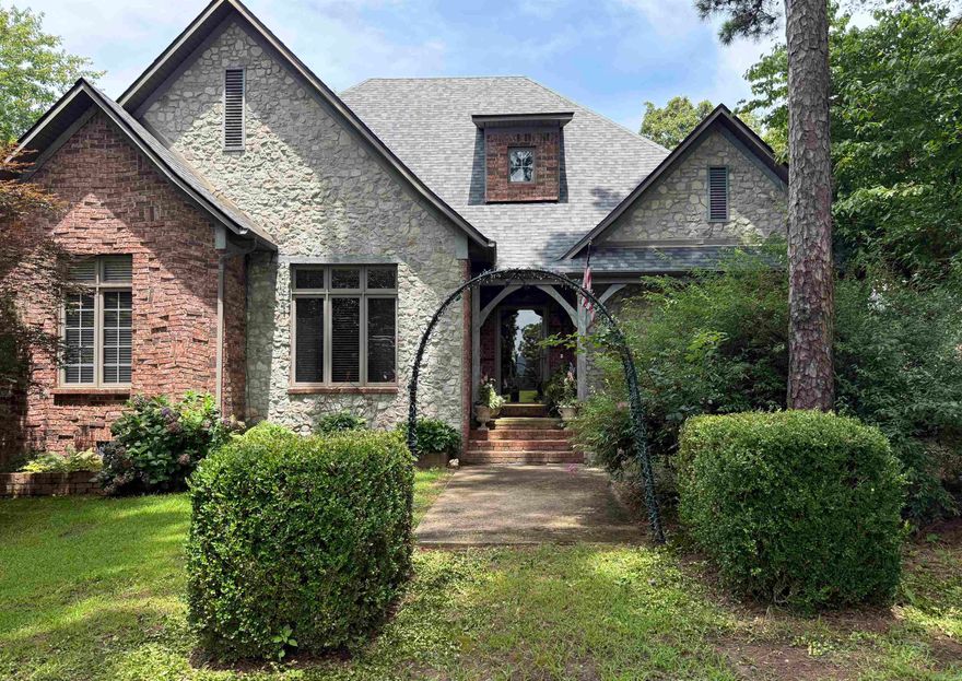 Tucked away in the breathtaking Ozark Mountains, this stunning Country French-style estate offers luxury, charm, and tranquility on 20 picturesque acres—ideally situated with acreage spanning both city and county lines. From the moment you arrive, you’ll be captivated by the elegant architecture and timeless appeal. As you walk through the front door you will notice the teller windows that front the home office. The heart of the home is a chef’s dream kitchen, featuring premium appliances, custom cabinetry, and a spacious layout perfect for entertaining or crafting gourmet meals. The master suite is the stuff dreams are made of, boasting soaring ceilings, a spa-like ensuite bath, massive walk-in closets, and private access to the outdoor patio where you can enjoy the privacy this land offers. Downstairs, the finished basement is an entertainer's paradise, complete with a game room, safe room, and ample space for gatherings. The estate also includes a charming guest house with a versatile craft room and a fully equipped workshop/garage, ideal for hobbies, hosting, or extended stays. This estate offers more than can be listed here so call today and schedule your showing!