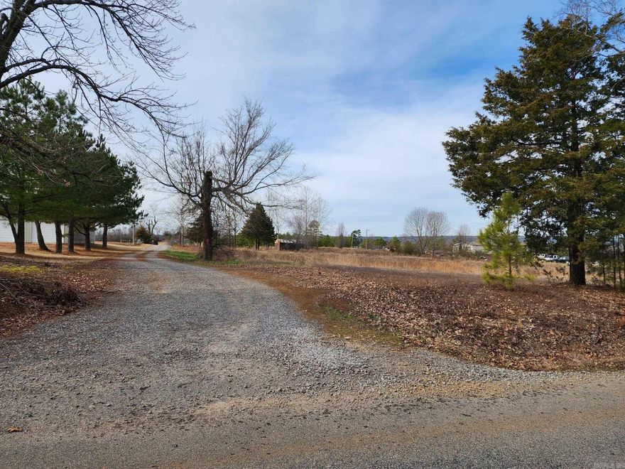This 2 acre tract in the Centerhill community is on a paved road. There is a water meter, power pole with electrical breaker box & meter & driveway already on the property where a trailer was located until recently. The driveway is on the left side of property & also serves as an easement to the property behind it. Old shed is on the property but will need a lot of work. No survey or seller property disclosure are available. Seller does not own mineral rights.