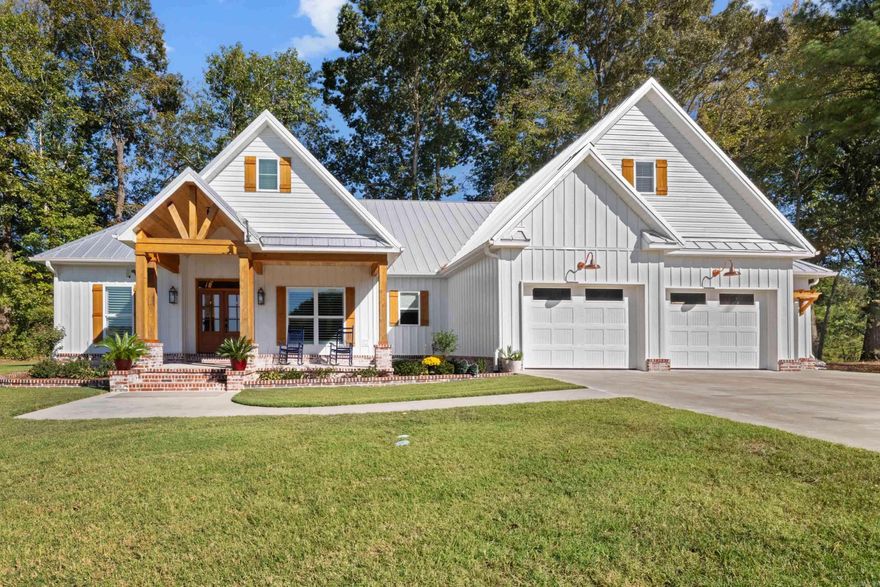 LITTLE RED RIVER! Discover the perfect blend of charm, comfort, and waterfront living in this beautiful craftsman-style riverfront home. Designed for both relaxation and entertaining, this property offers peaceful views, amazing rock work down to the shoreline, your very own private boat dock, creating a striking natural landscape and easy water access.  Step inside to an inviting open-concept living and kitchen area filled with natural light and river views. The home offers 3 spacious bedrooms, 2.5 baths, and a bonus room above the garage—ideal for a guest suite, playroom, or home office.  A screened porch overlooking the river provides the perfect spot to unwind & enjoy the sights & sounds of the water. The primary suite offers comfort and privacy, while the thoughtful floor plan keeps everything convenient & connected. Car enthusiasts & hobbyists will love the 3-car attached garage plus an additional detached garage/shop, offering plenty of storage and workspace. For added safety, a storm room provides peace of mind year-round. Every detail has been carefully designed to make this home both functional and beautiful—a true riverfront retreat where every day feels like a getaway.