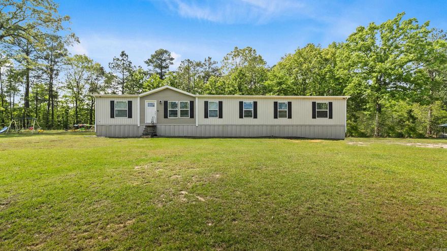 Beautifully maintained double-wide mobile home located in the highly sought-after Genoa School District. This spacious property offers 4 bedrooms, 3 full bathrooms, two living areas, and a dedicated office space—perfect for both everyday living and working from home. The well-appointed kitchen features a large island, a charming coffee bar, and ample storage, complemented by a generously sized utility room. Situated on 4.24 scenic acres, the property includes a tranquil pond and abundant wildlife, providing a true country living experience. Step outside to enjoy the covered patio, ideal for relaxing or entertaining while taking in the peaceful surroundings. This well-priced property offers the perfect blend of space, comfort, and rural charm—don’t miss your opportunity to make it your own.