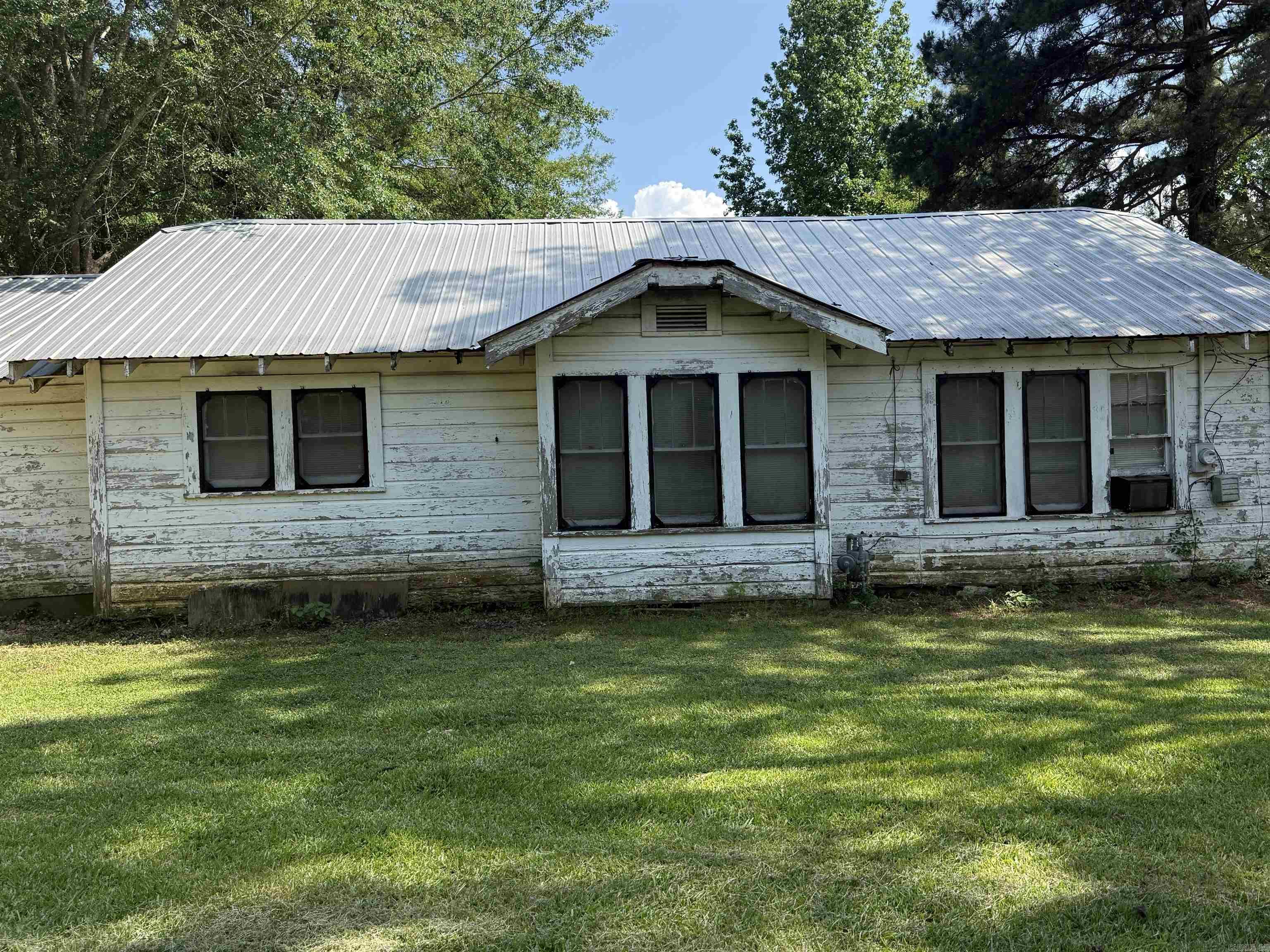 This charming little home is ready for a new owner. It has space that is gracious throat. From the outside yo would never even know how big it is inside! There's ample room in each of the bedrooms and tasteful through out. This is move in ready! This is being sold AS IS WHERE IS WITH ALL FAULTS
