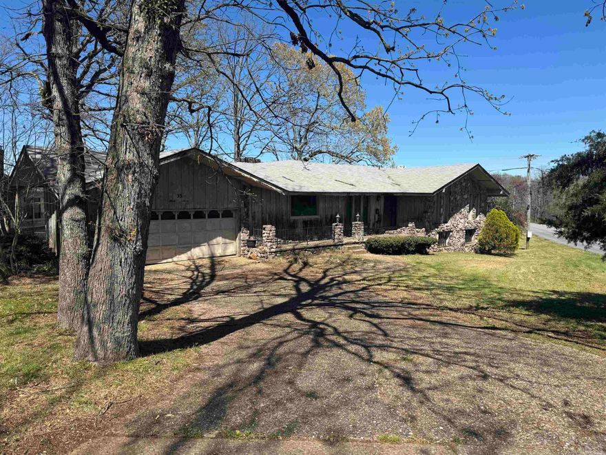 Big house on the lake! 4 bed, 2.5 bath on the 2286 sq ft main level, then another 988+/- sq ft on lower level that could be finished out with walkout to the land/lake. Needs updating but has potential to be a really nice place with amazing views of the water. Exterior appears to be cypress plank. 2 car garage. Private fishing lake has boat ramp down the street included in your dues ($125/year as of 2024). See www.indianheadlake.com Recent foreclosure, not REO or bank owned. Local corporate owner can close quickly. Sold as is, no disclosure. SEE AGENT REMARKS for offer submission info.