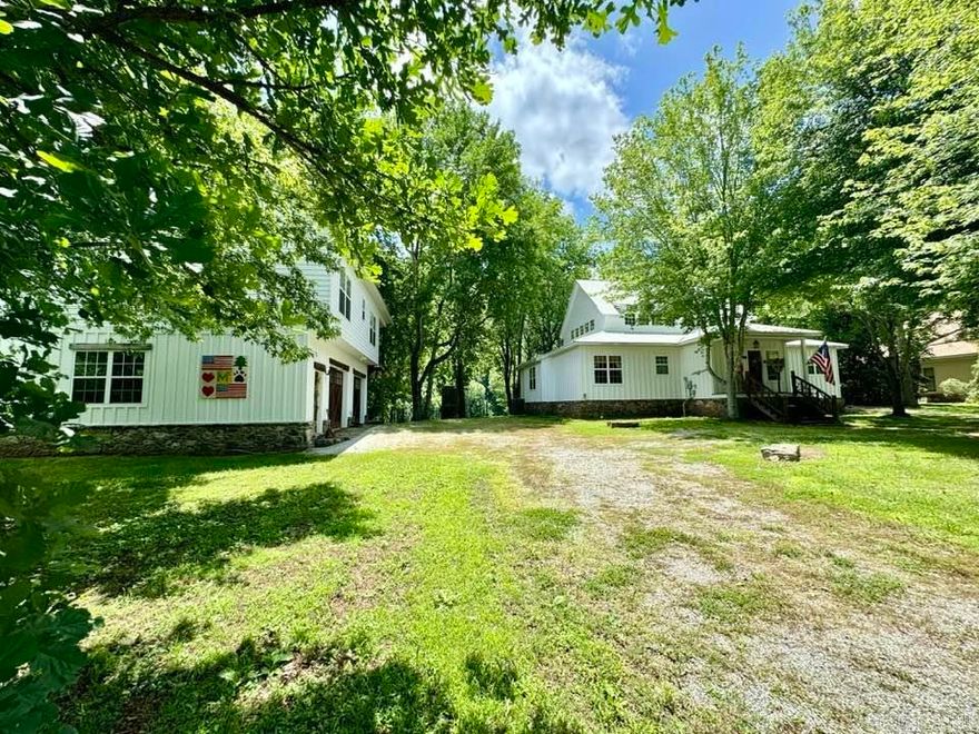 Two yes two fully furnished homes including outdoor items for gatherings and water activities available on the White River, each offering beautiful river frontage on a spacious 1.62 acres m/l with the homes and added are 2 lots across from the houses at 1.85 acres m/l for a total of 3.47 acres m/l. Both properties feature upper and lower decks, providing amble outdoor living space. The lower deck is constructed of laid rocks with a large fireplace, perfect for gatherings or just some serene time in nature. Enjoy breathtaking views from both houses, creating an ideal setting for relaxation or entertaining. 2 Main bedrooms and 4 guest bedrooms with 2 being loft bedrooms one in each home. Hand carvings in the doors that match the decor with furnishings to match as well. RV Parking and hookup for those extra guests when needed.